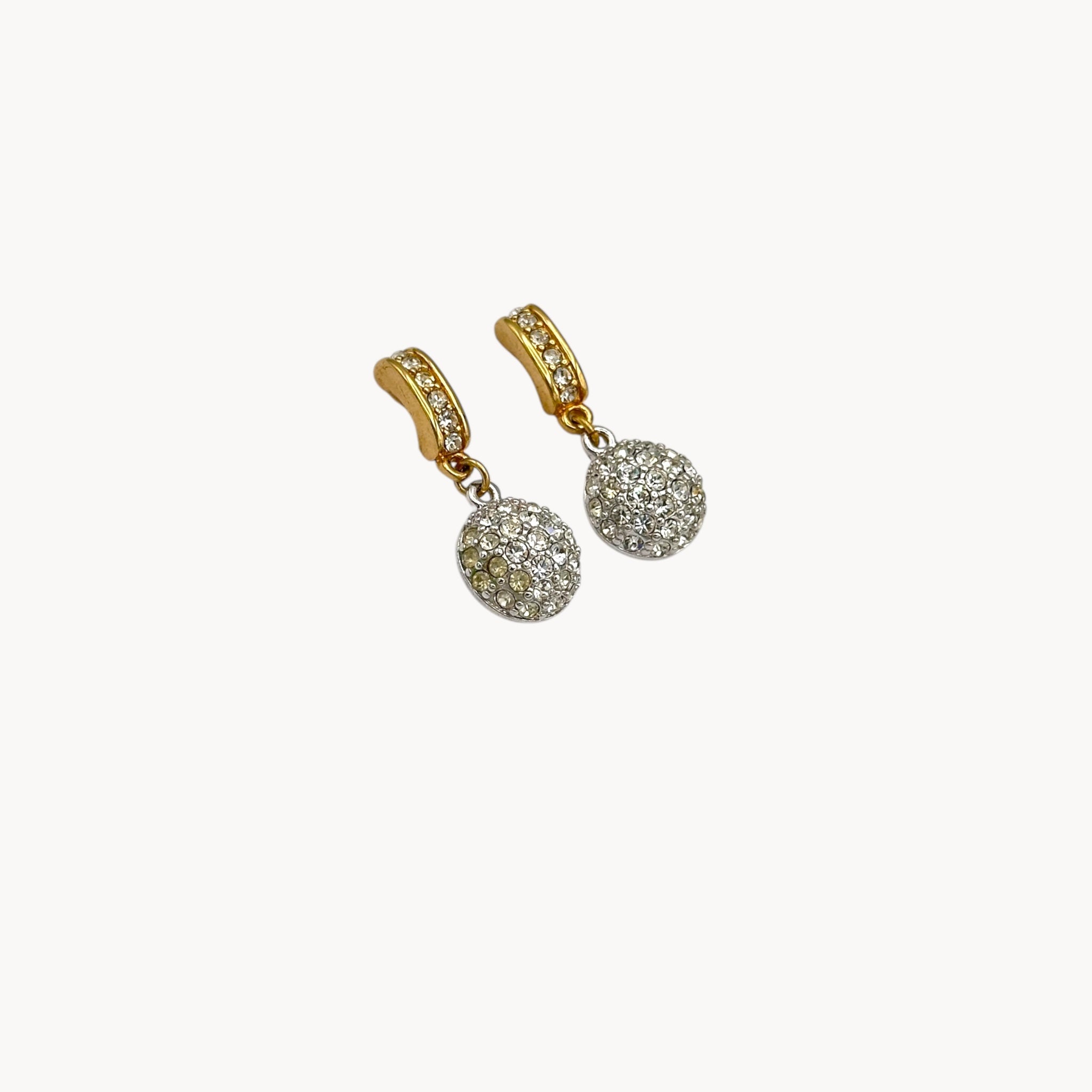 Side view of vintage Swarovski gold and crystal pavé dangle earrings with hoop top and round drop, vintage bridal jewelry.