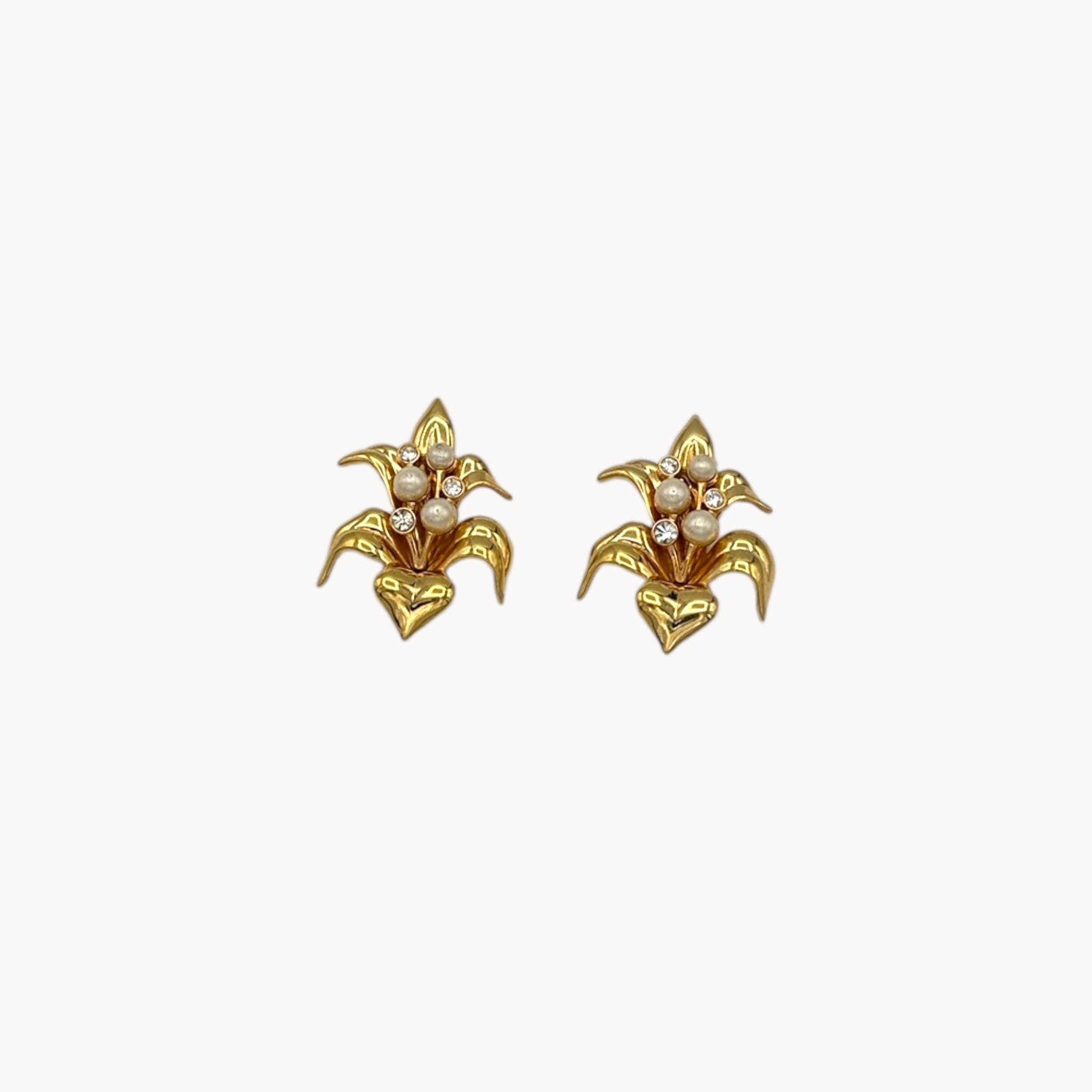 Vintage Swarovski SAL floral clip-on earrings with gold-tone petals, faux pearls, and crystal accents, 1980s bridal jewelry