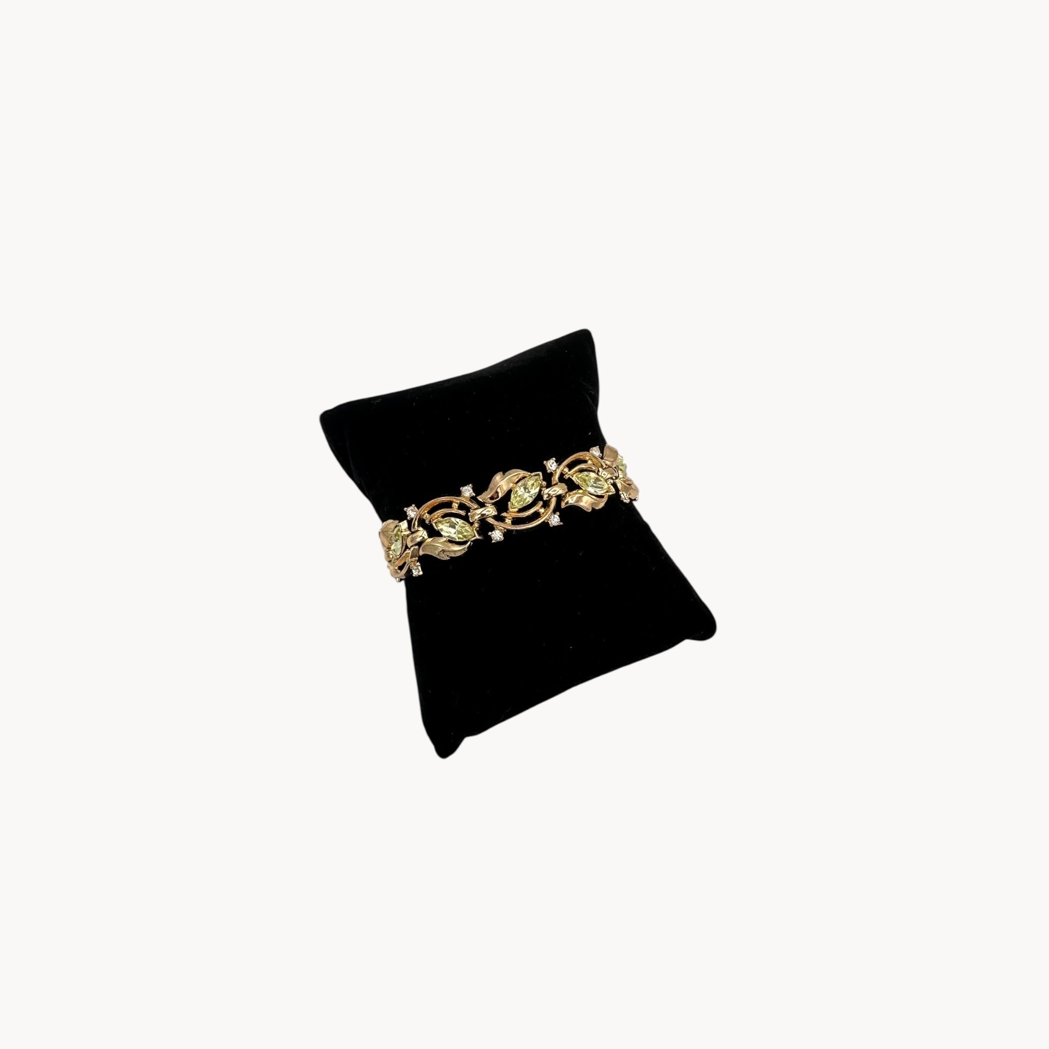 bracelet view Vintage Trifari bracelet and clip-on earring set with peridot green marquise rhinestones and clear crystal accents, 1950s–1960s jewelry.