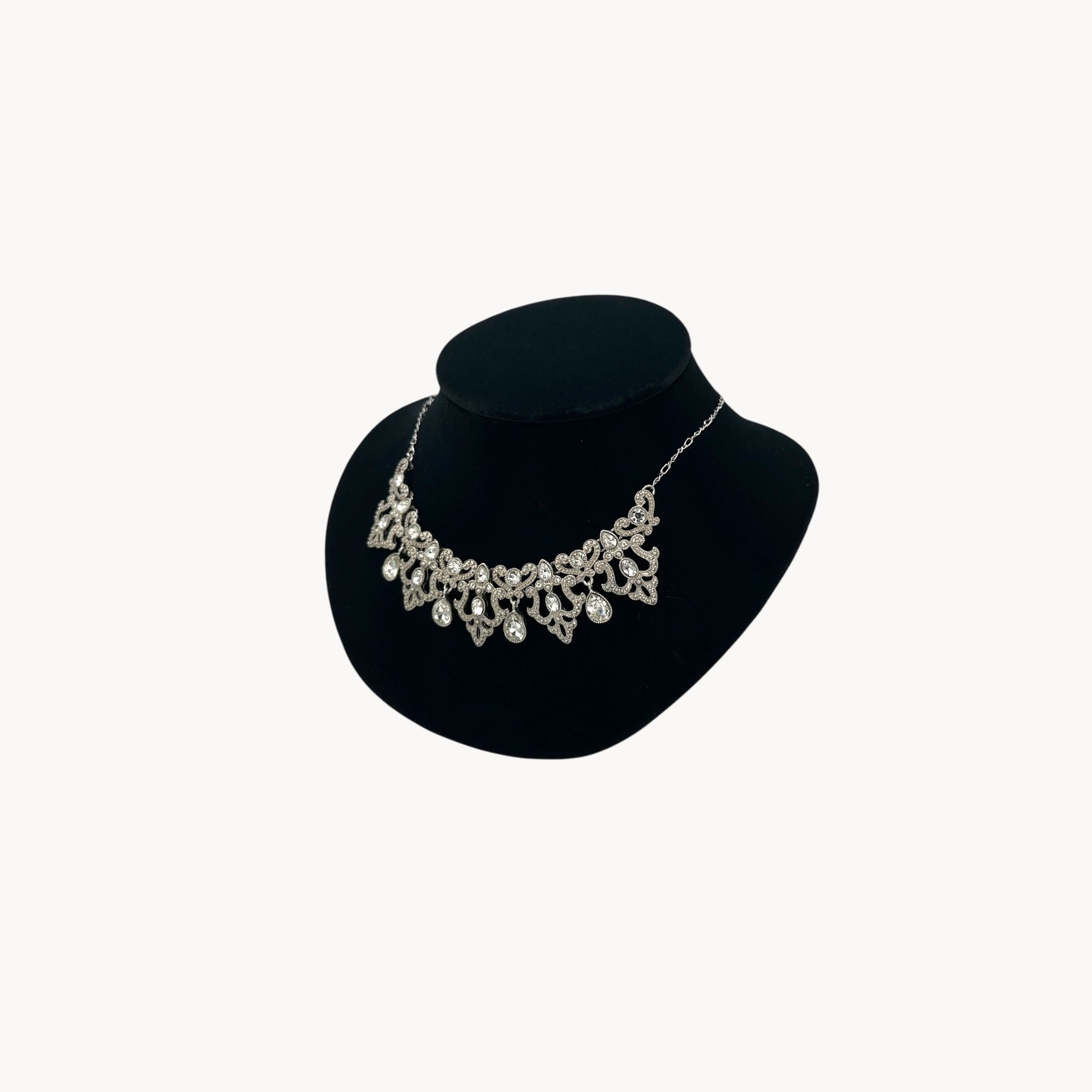 Side view of Vintage 1990s Trifari rhinestone statement necklace with teardrop accents