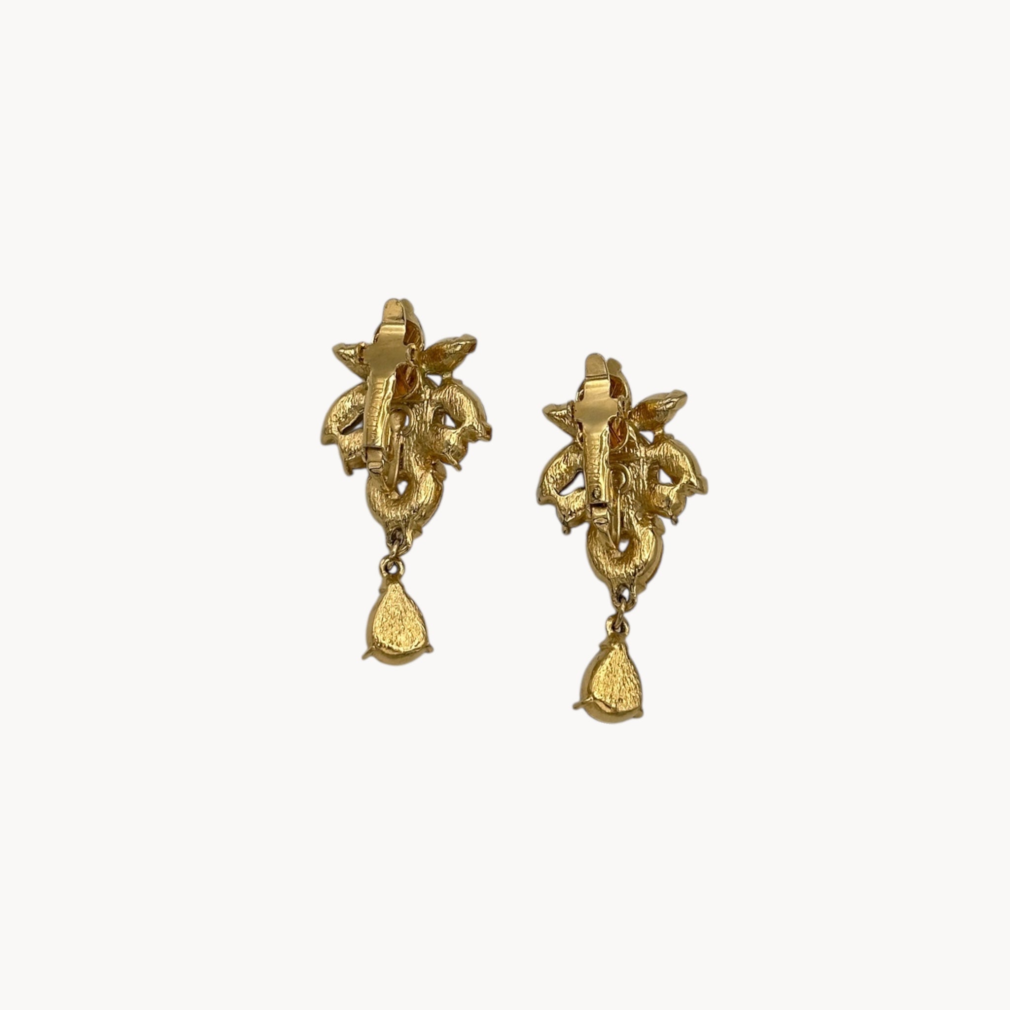 Back view of 1990s Trifari faux pearl and crystal clip-on earrings in gold-tone with teardrop design, vintage bridal jewelry.
