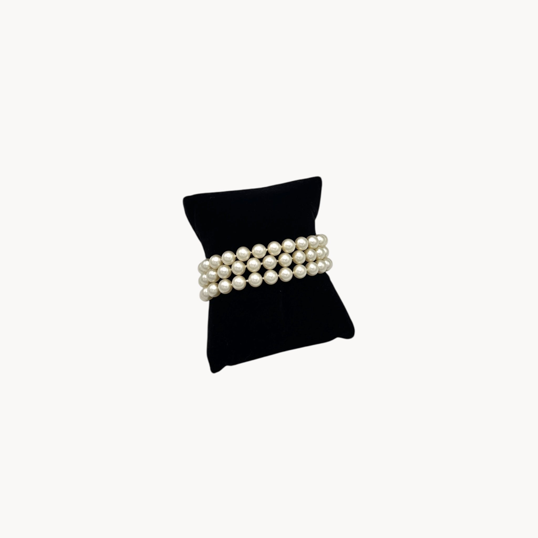 back view Vintage Trifari faux pearl triple-strand bracelet with baguette crystal clasp, 1950s–1960s bridal jewelry