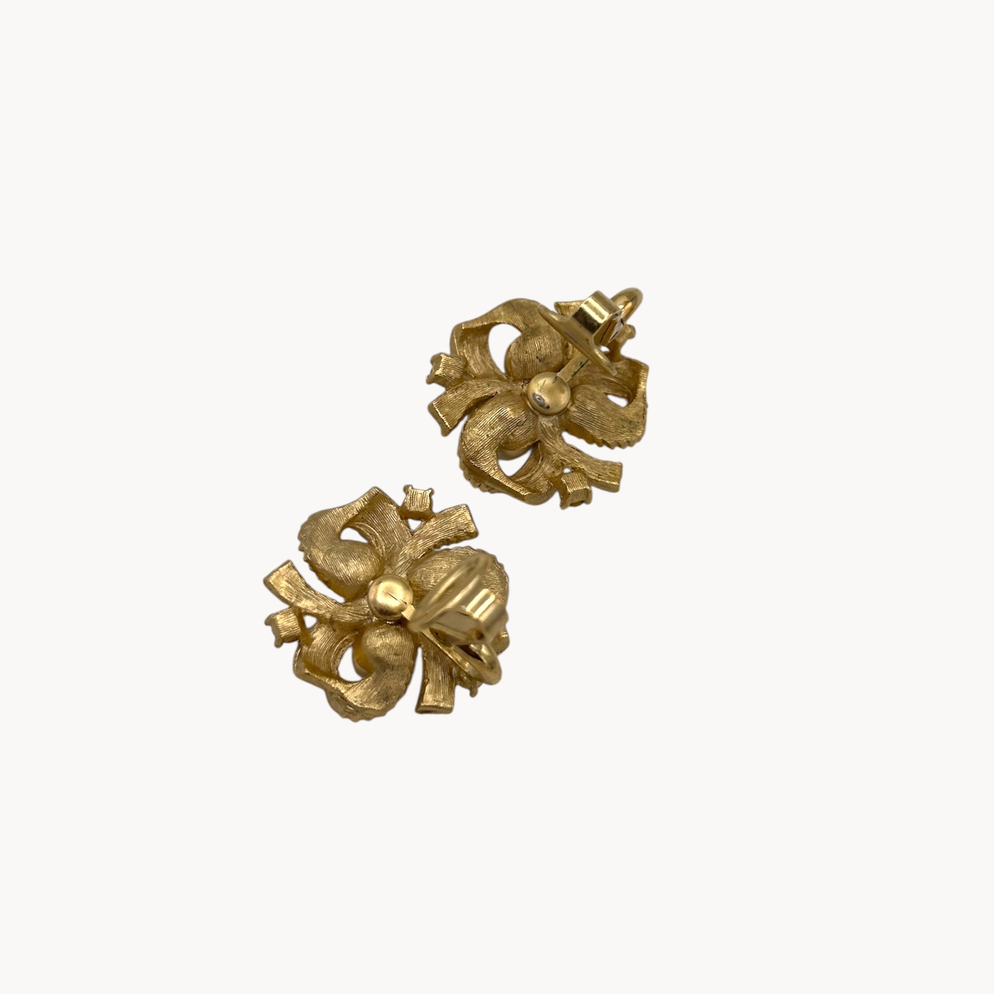 back view with clip up Vintage Trifari clip-on earrings with gold bow design, faux pearls, and crystal accents, 1960s bridal jewelry.
