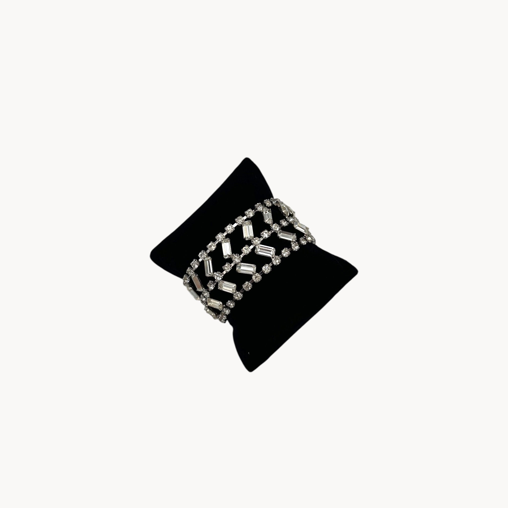 Side view of Vintage wide rhinestone bracelet with round and baguette-cut stones