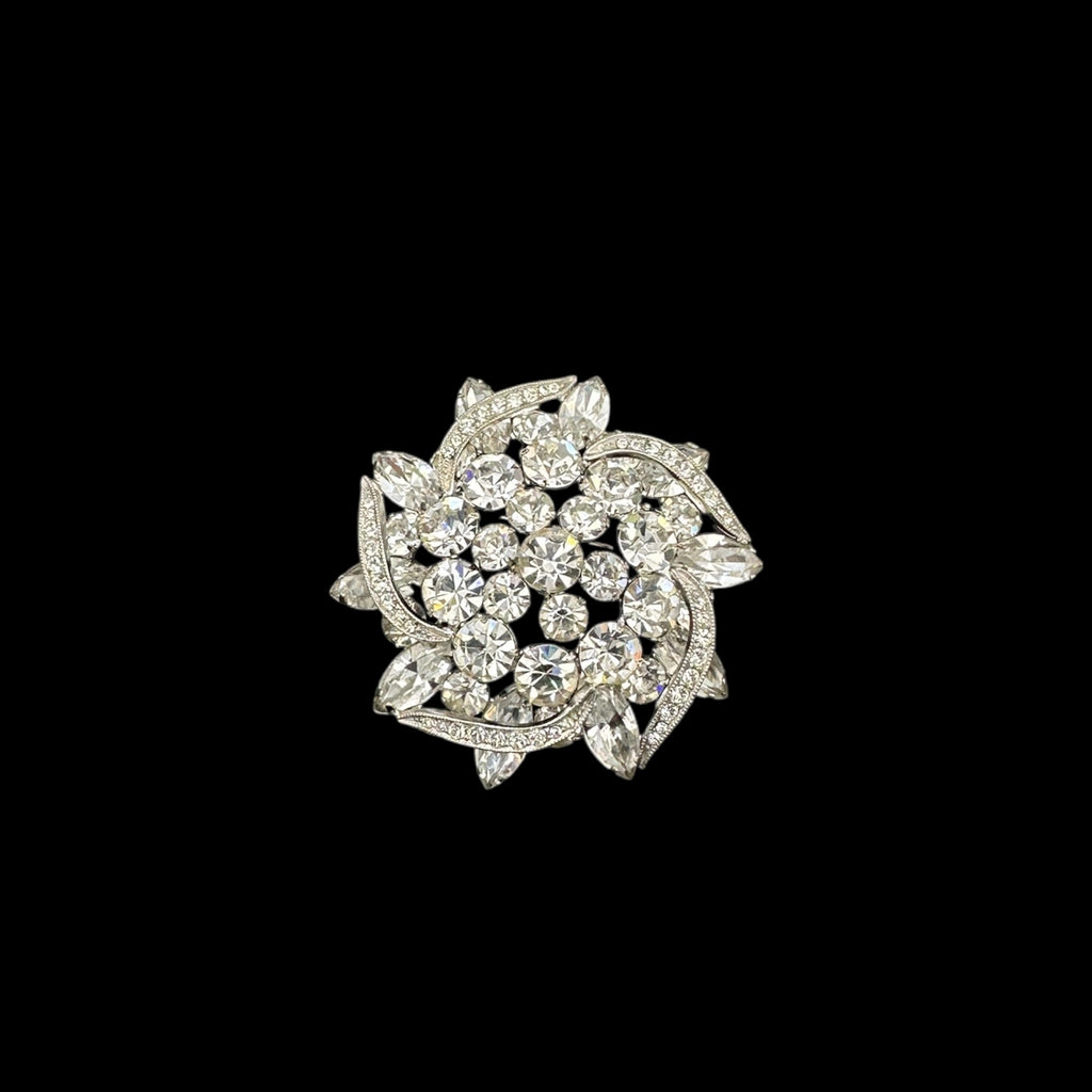 Close up of brooch on black background Weiss rhinestone brooch and earring set with vintage floral design