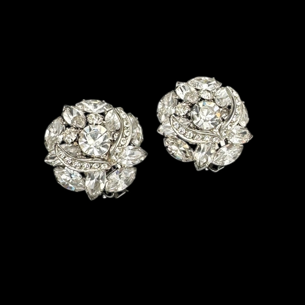 Close up against black of Vintage Weiss Weiss rhinestone earring s vintage floral design