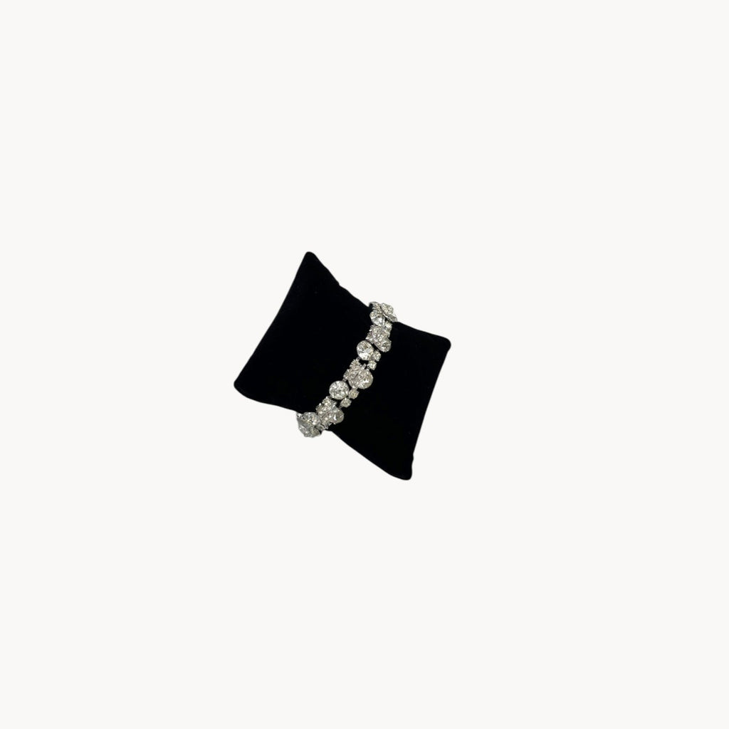 Side view of Vintage Weiss rhinestone statement bracelet with large prong-set stones.