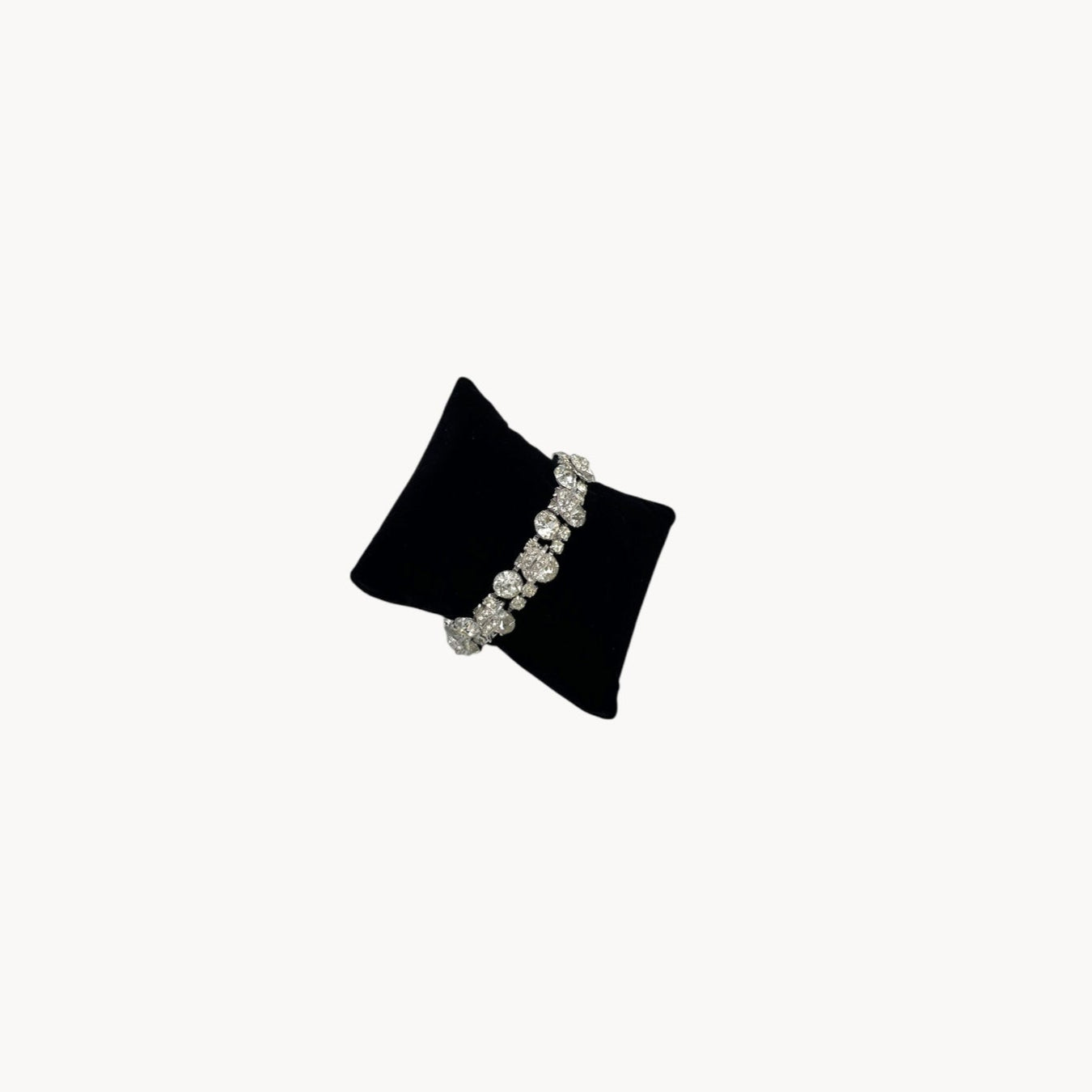 Side view of Vintage Weiss rhinestone statement bracelet with large prong-set stones.