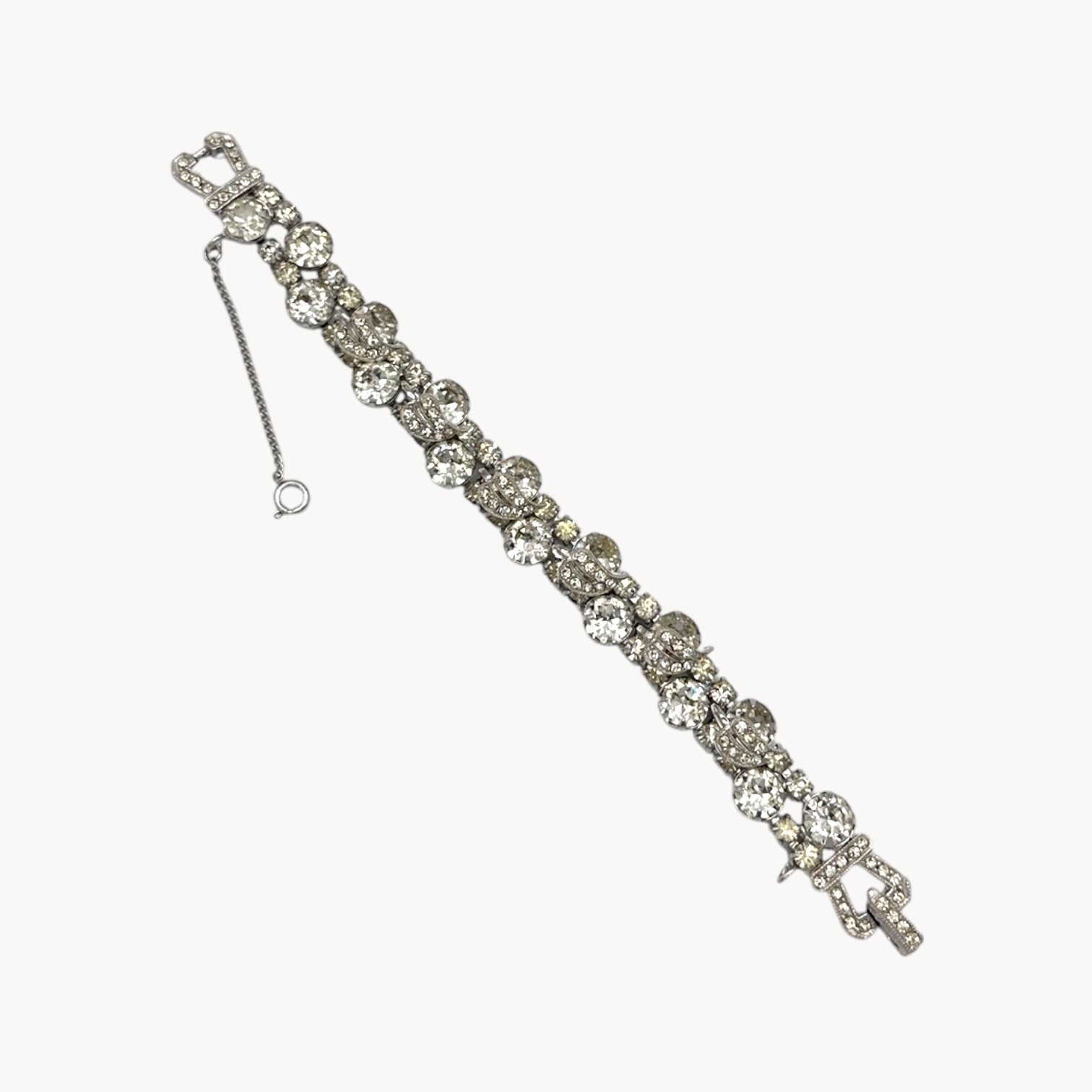 Flat lay of Vintage Weiss rhinestone statement bracelet with large prong-set stones.
