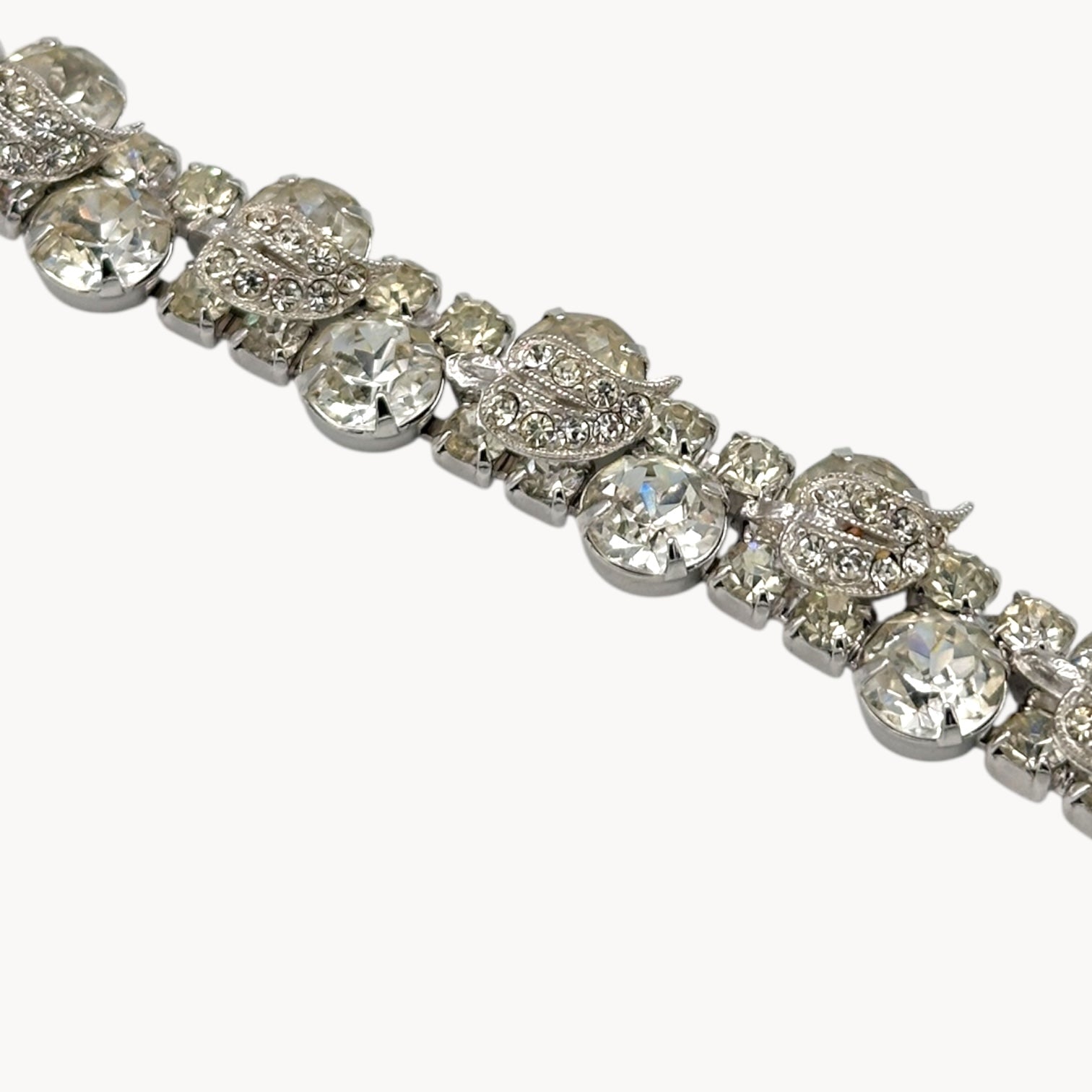 Close up view of detail of Vintage Weiss rhinestone statement bracelet with large prong-set stones.