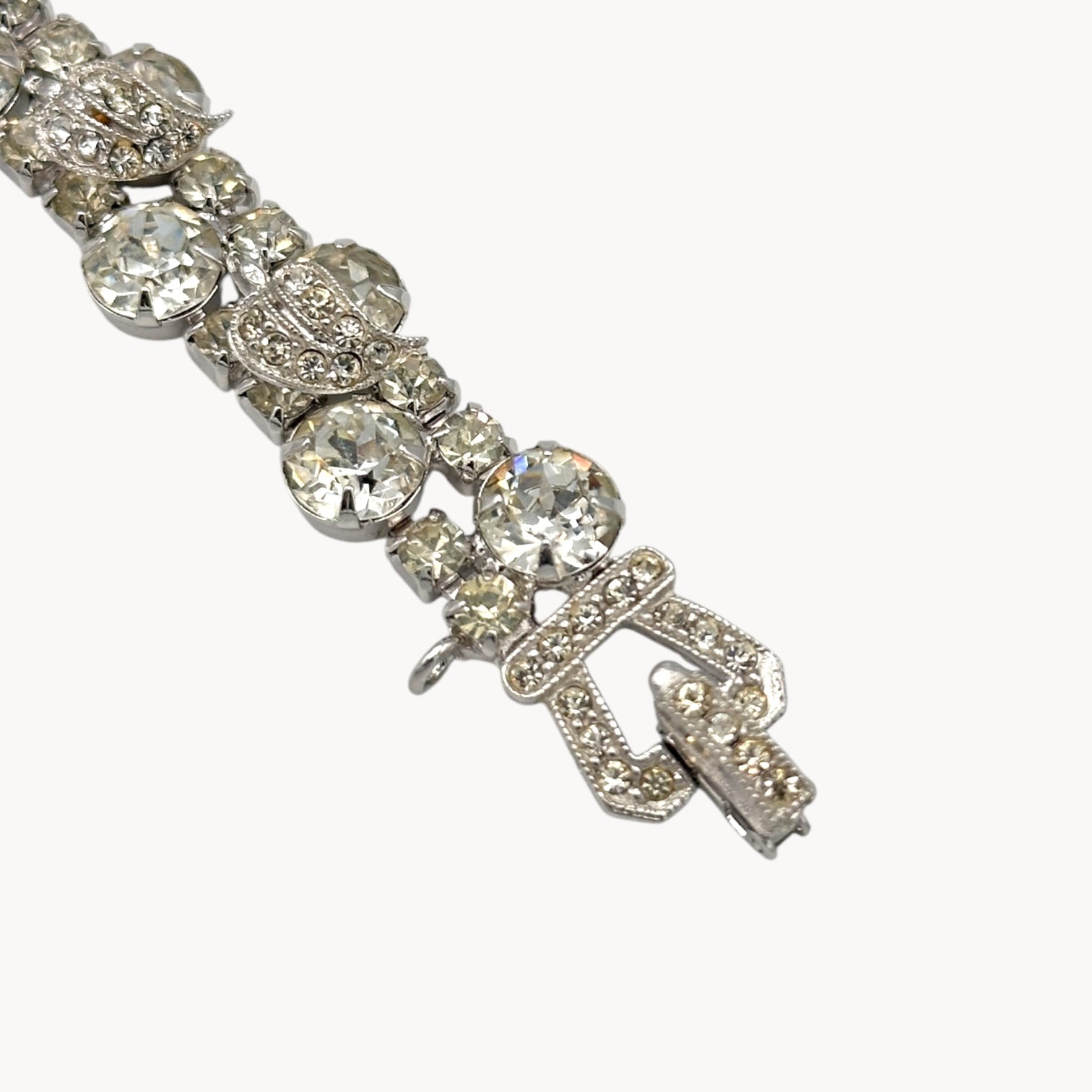 Close up view of clasp of Vintage Weiss rhinestone statement bracelet with large prong-set stones.