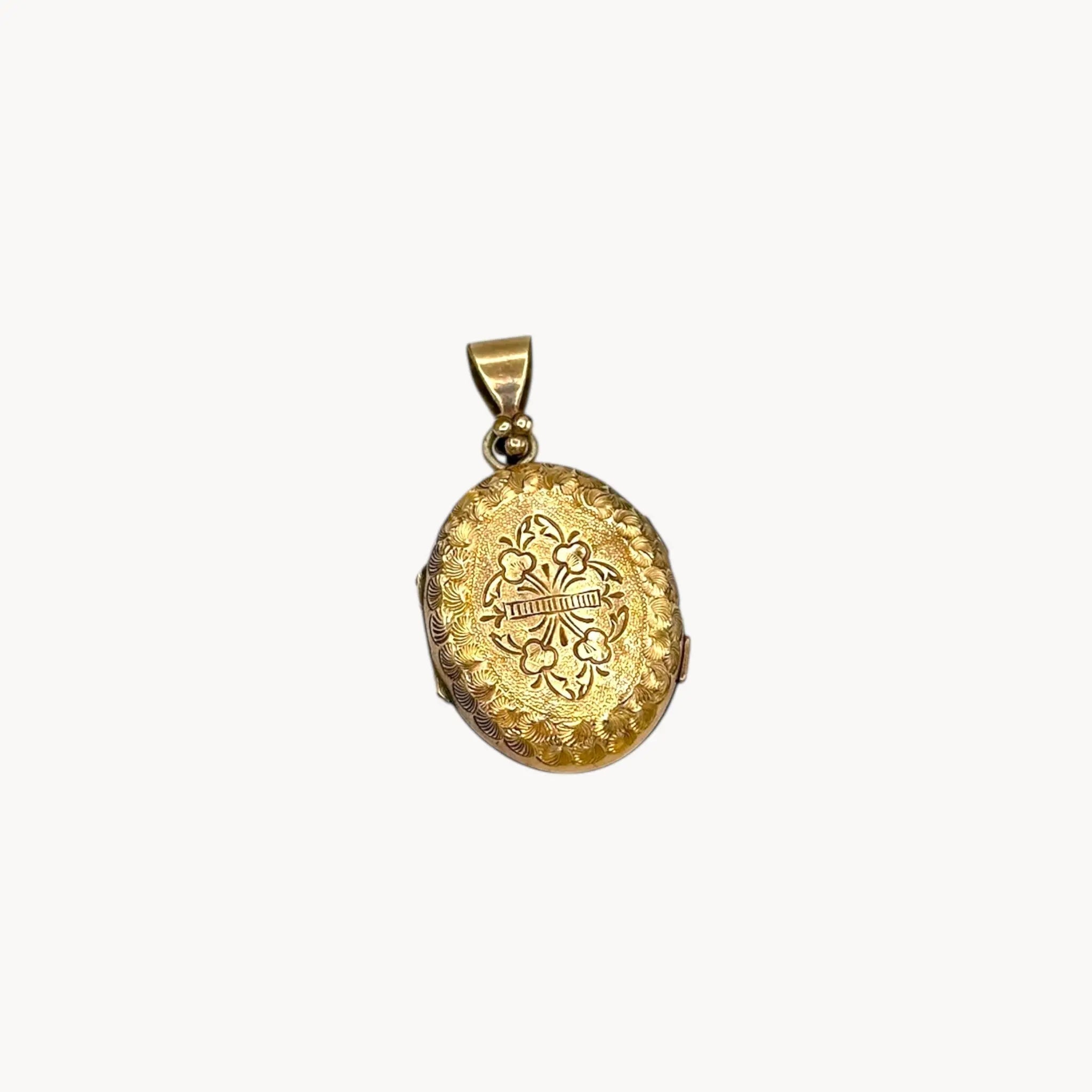Antique gold-filled etched floral locket with ornate border, Victorian keepsake pendant.