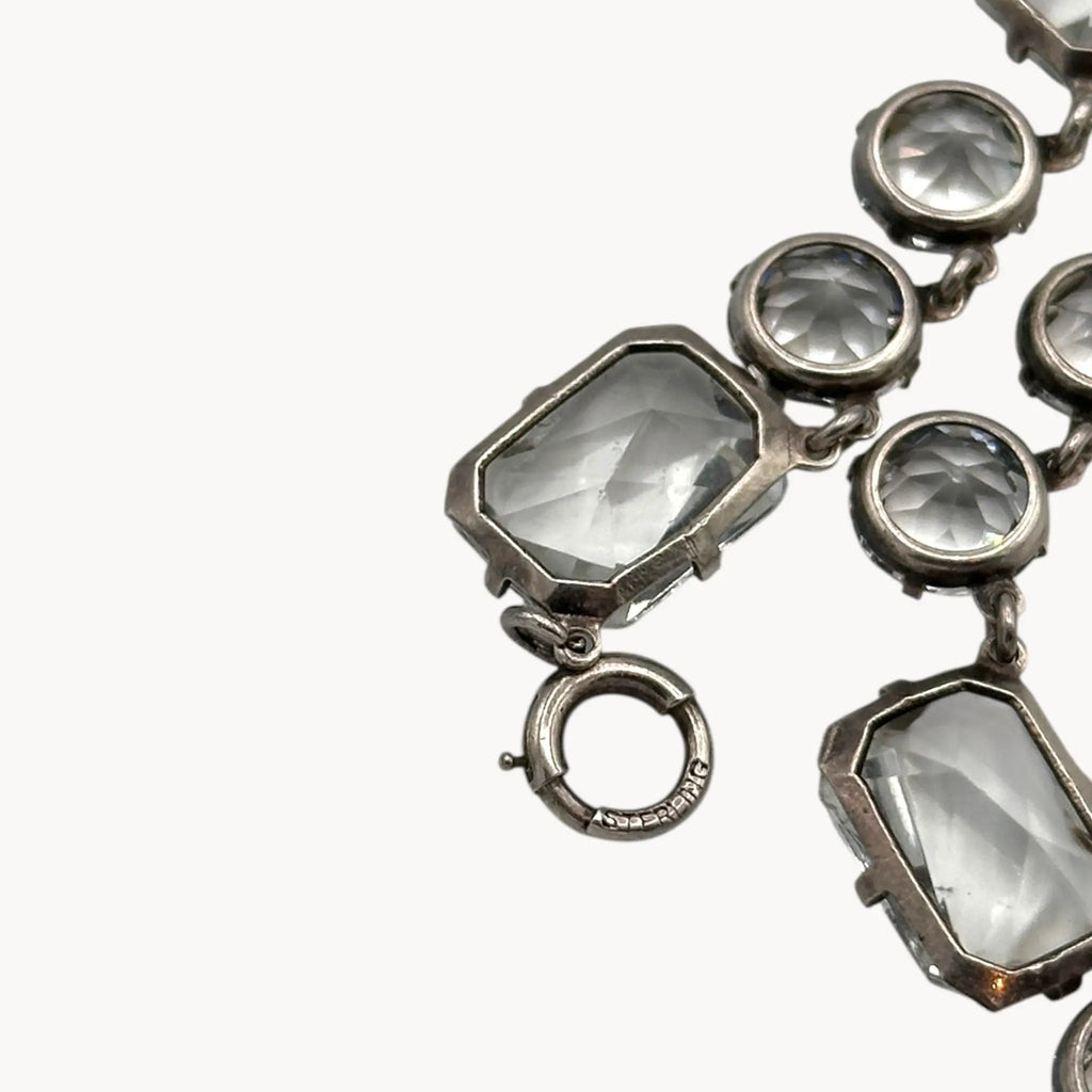 Clasp close up of Vintage Art Deco crystal necklace with round and oval-cut crystals, stones.
