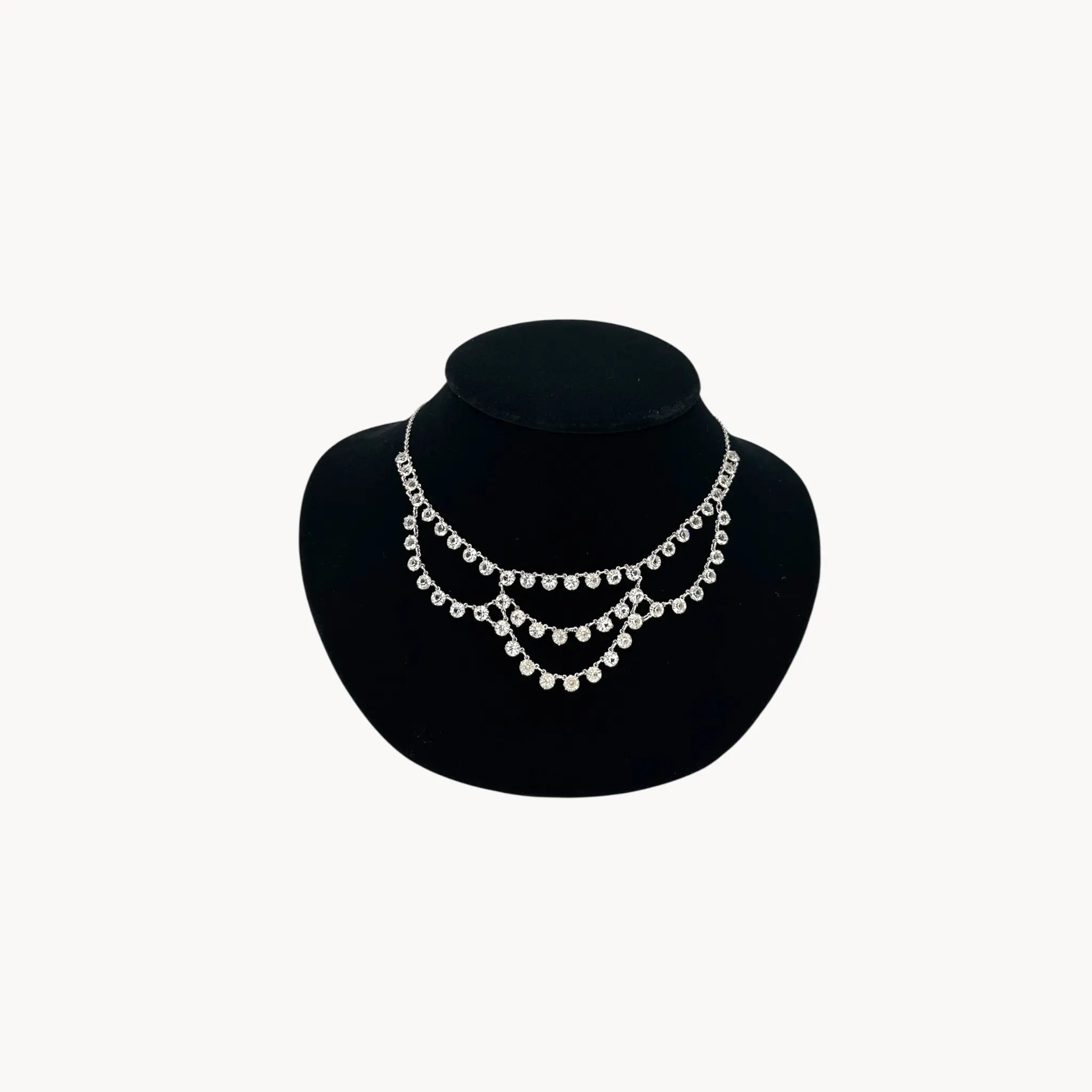 Art Deco style 12K gold-filled rhodium plated crystal draped necklace.