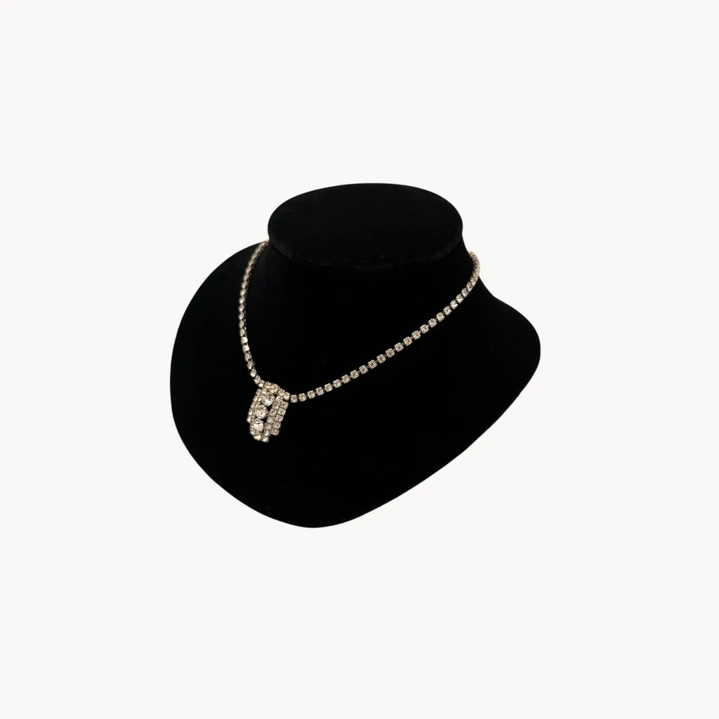 Side view of 1950s Art Deco style rhinestone necklace with geometric pendant drop, vintage mid-century bridal jewelry