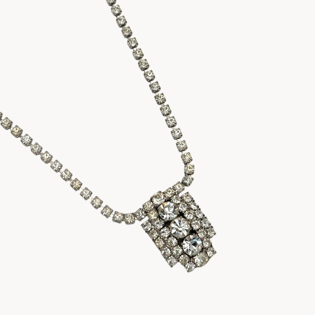 Close up of pendant of 1950s Art Deco style rhinestone necklace with geometric pendant drop, vintage mid-century bridal jewelry