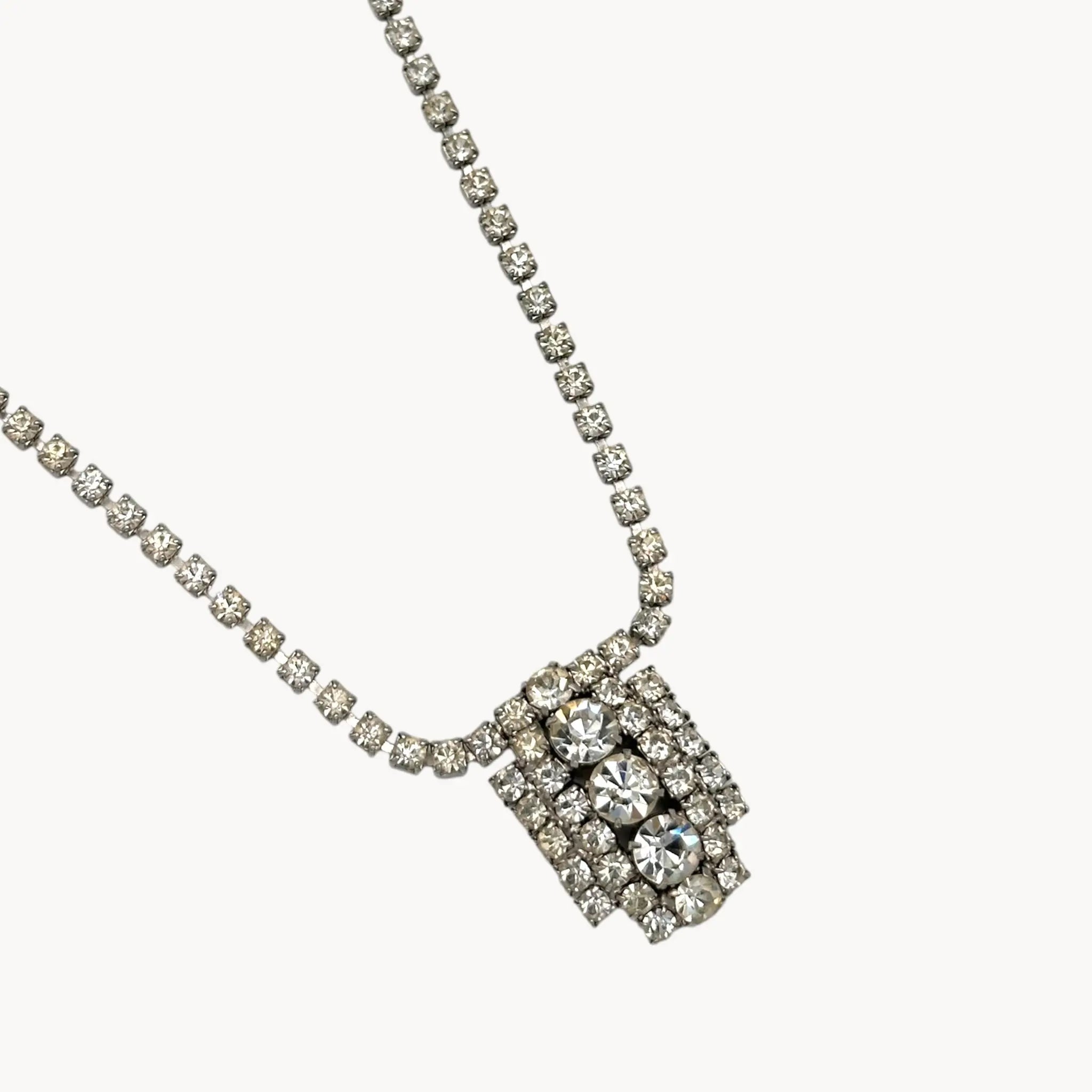 Close up of pendant of 1950s Art Deco style rhinestone necklace with geometric pendant drop, vintage mid-century bridal jewelry