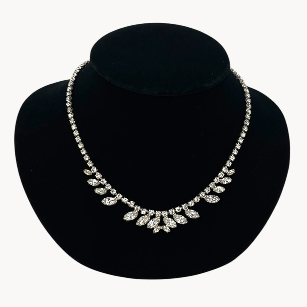 On bust view 1950s B. David rhinestone necklace with round and marquise stones in garland design, vintage bridal jewelry.
