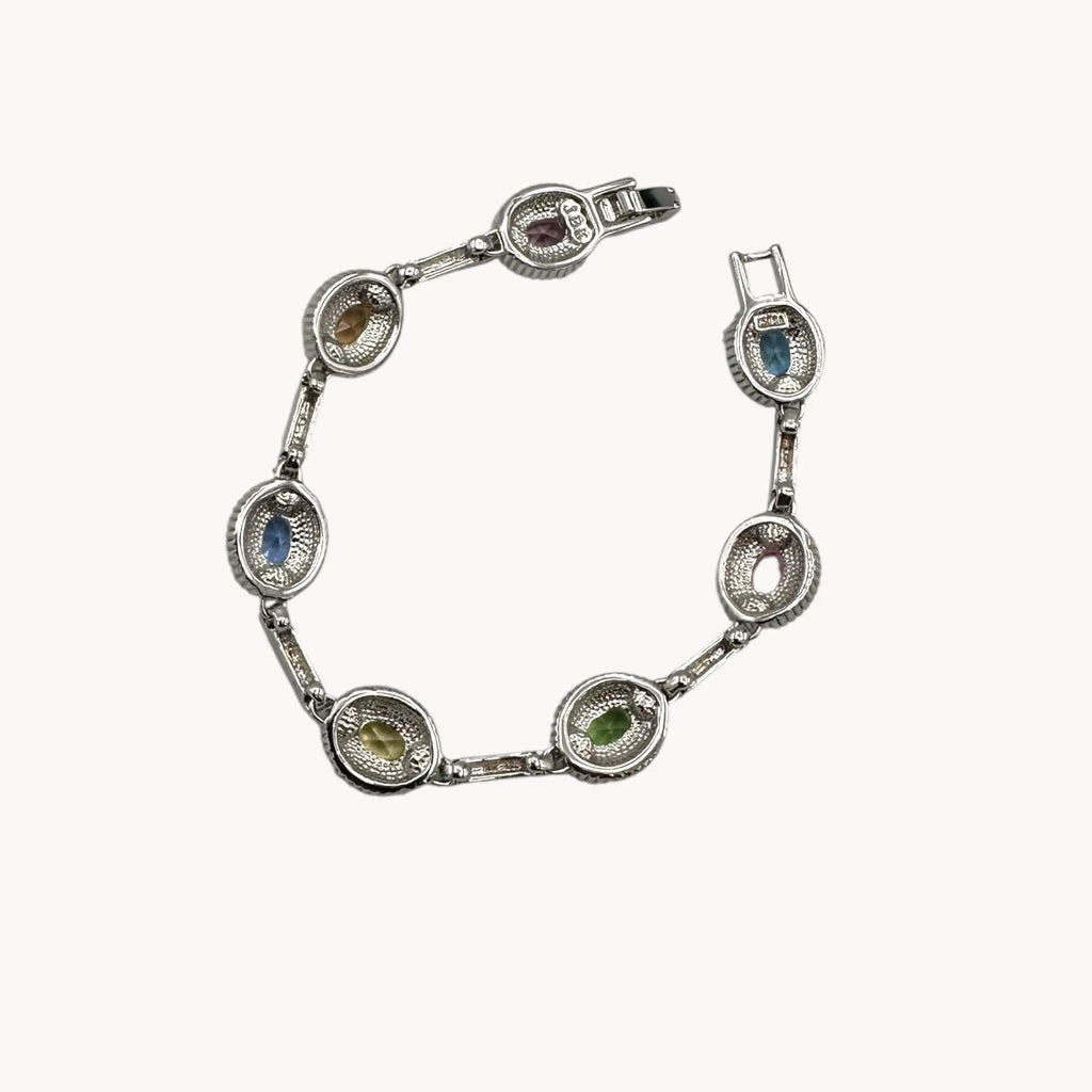 Back view of Camrose and Kross Jacqueline Kennedy JBK replica bracelet with multicolor stones and crystal accents