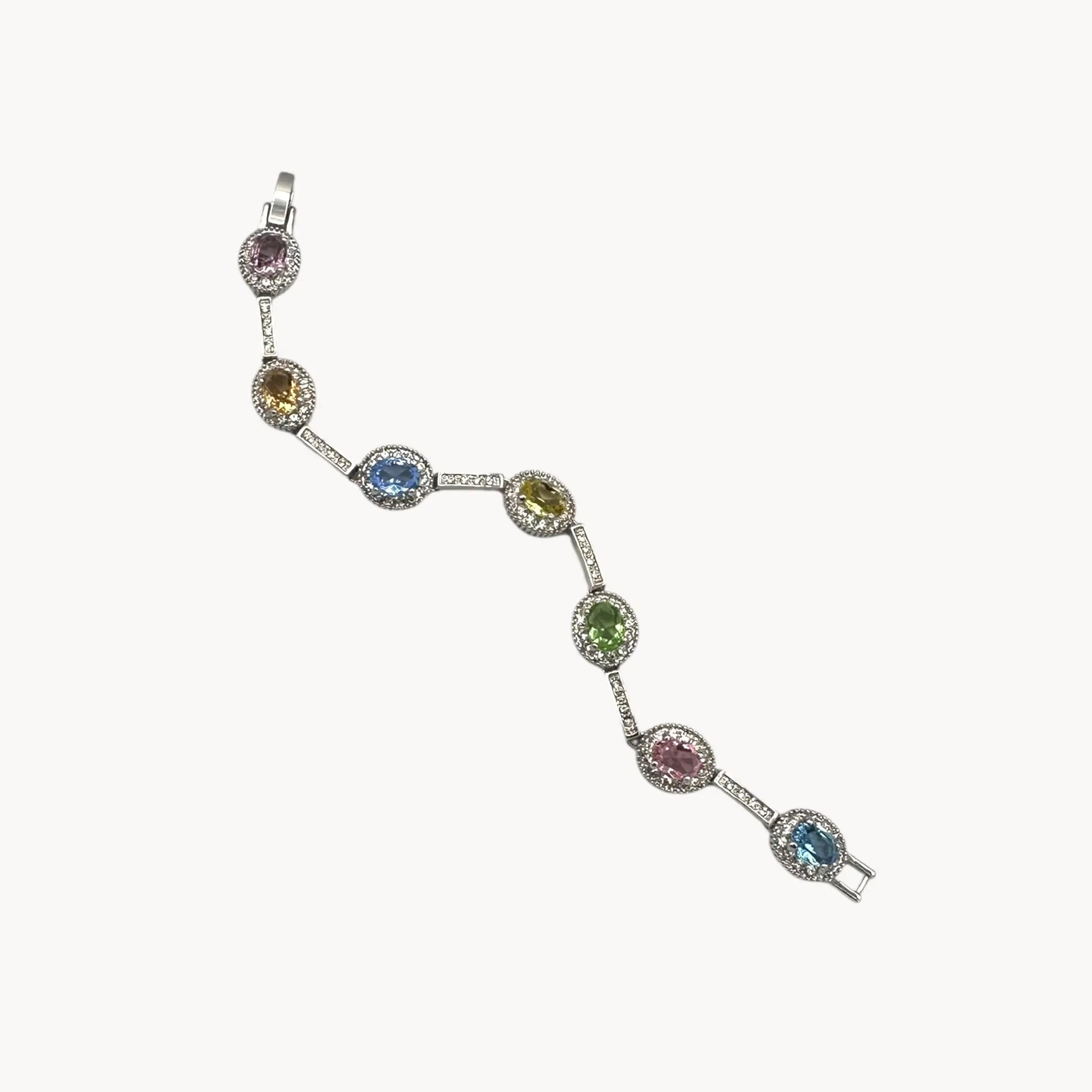 Against white background Camrose and Kross Jacqueline Kennedy JBK replica bracelet with multicolor stones and crystal accents