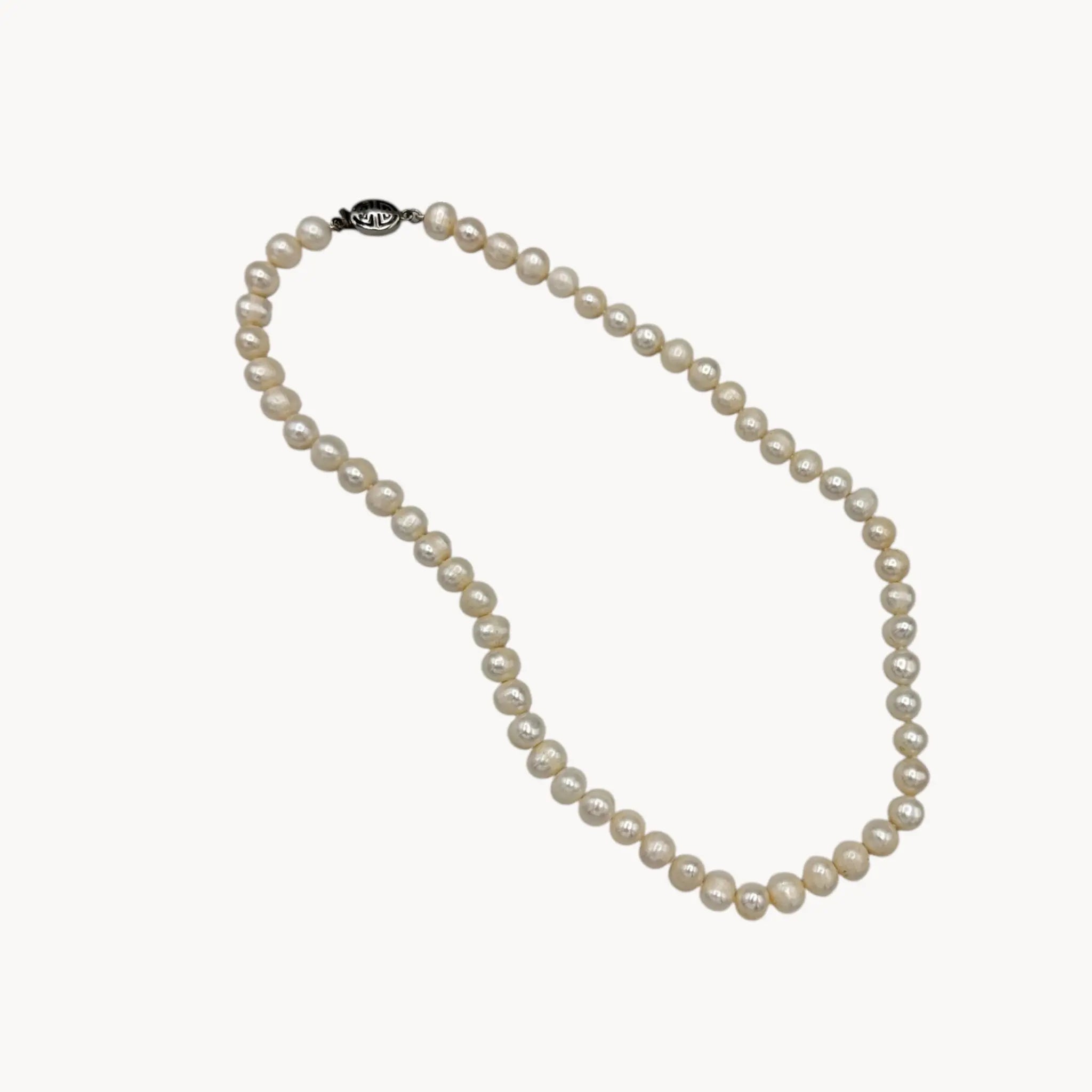 Pearl necklace on a white background