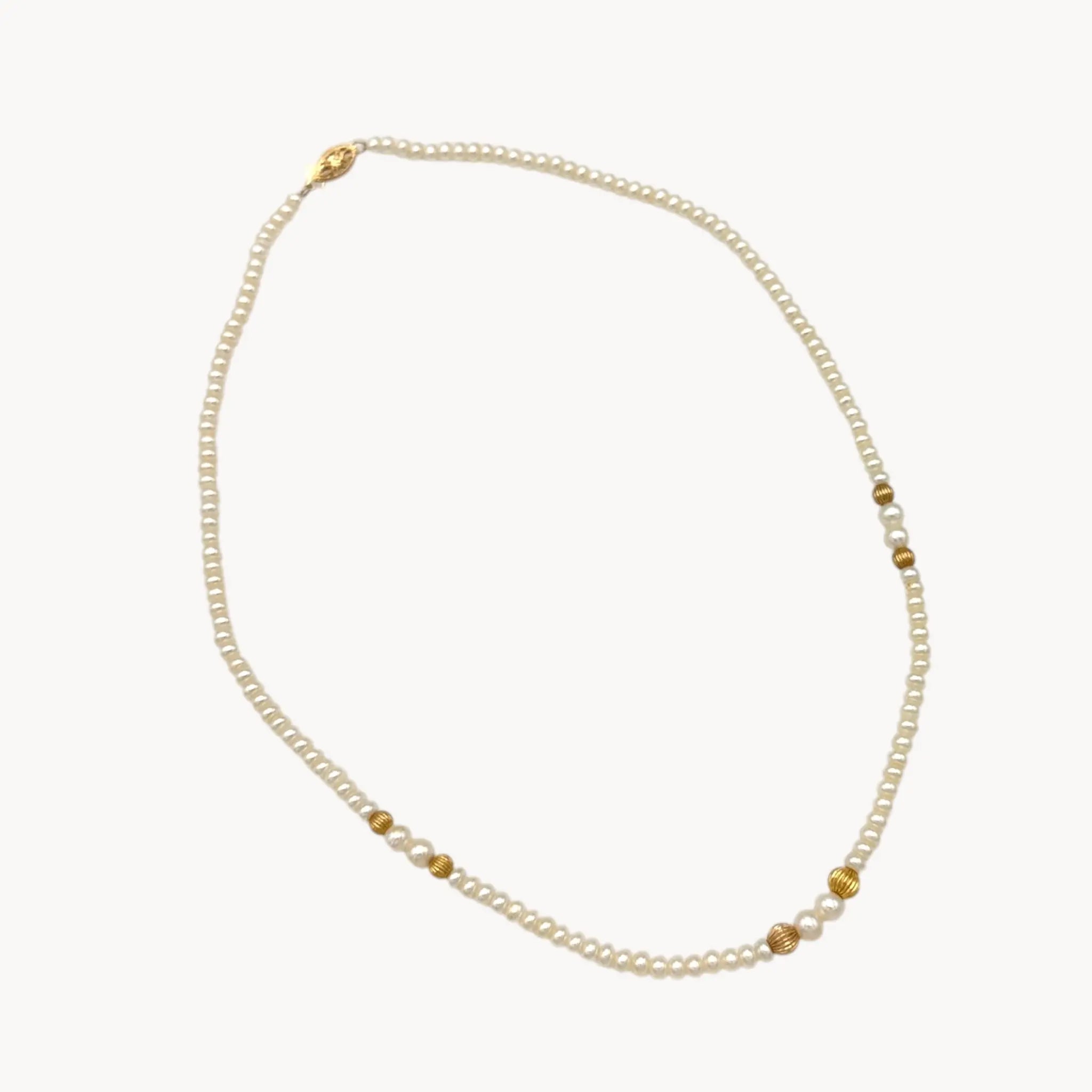 Classic pearl and 14K gold bead strand necklace, vintage fine jewelry on white background.