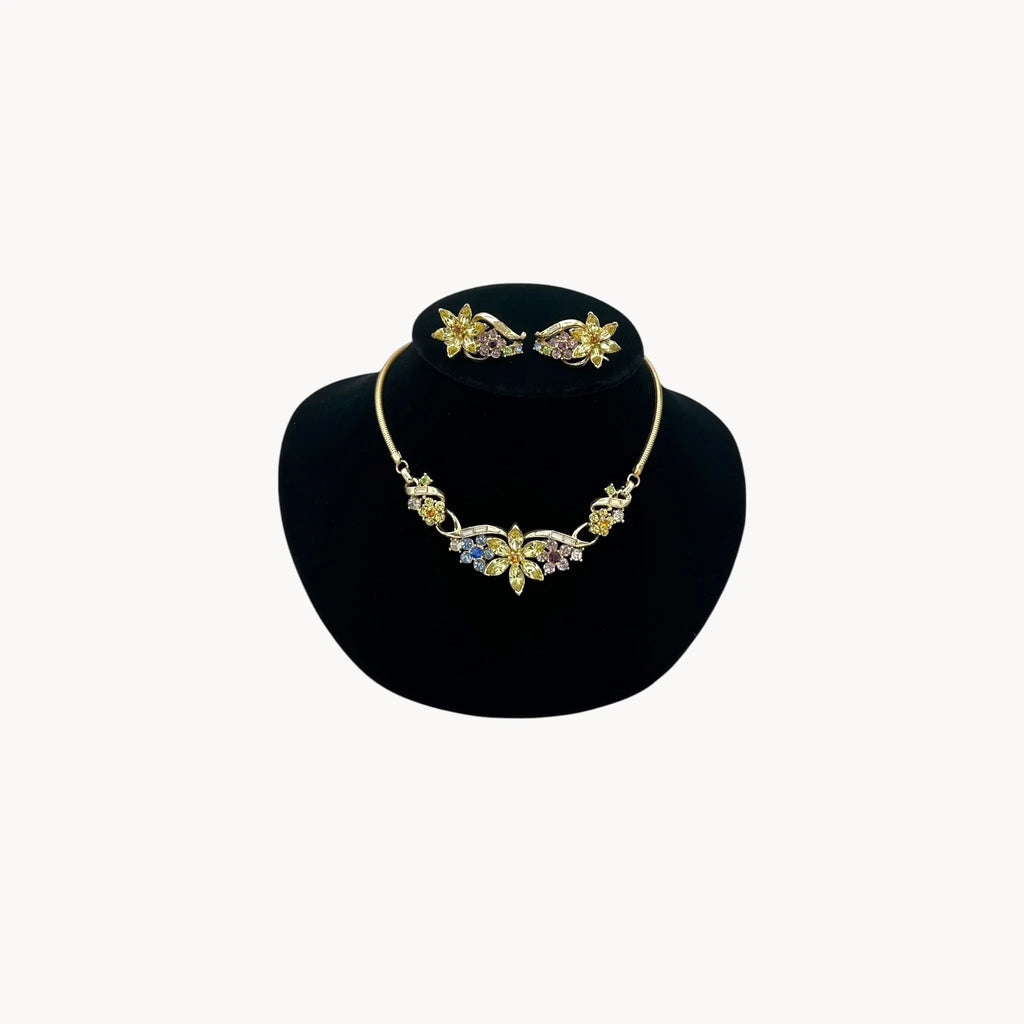 Vintage Coro multi-color rhinestone necklace and clip-on earring set with floral design.