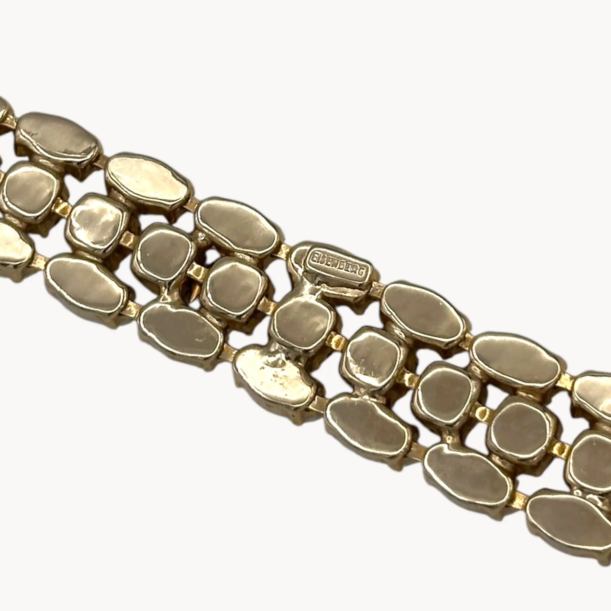 Close up back view of Mid-century Eisenberg bracelet with white milk glass and rhinestones, double-row design.