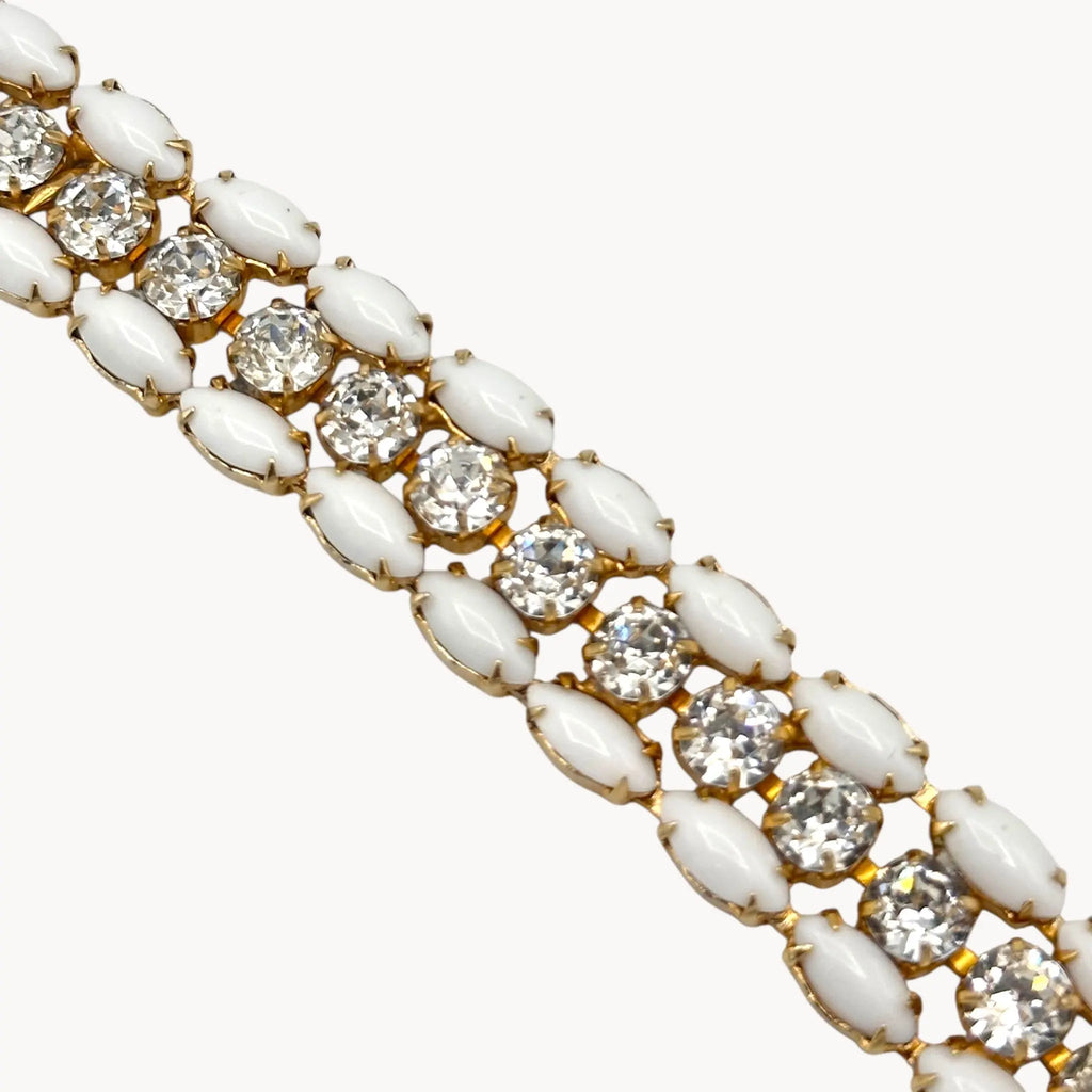 Close up view of Mid-century Eisenberg bracelet with white milk glass and rhinestones, double-row design.