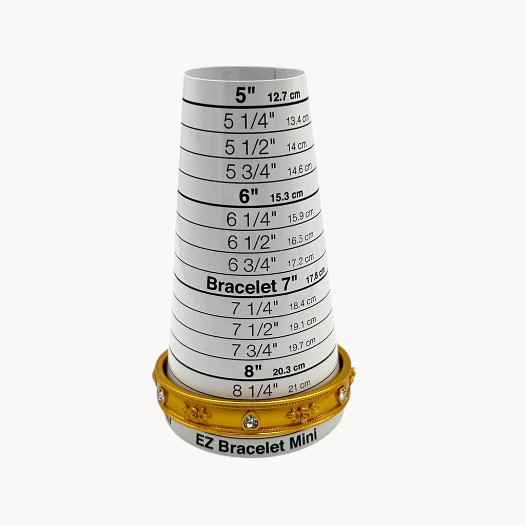 Size view of Elizabeth Taylor Love Blooms gold bangle bracelet with crystal heart and floral accents.