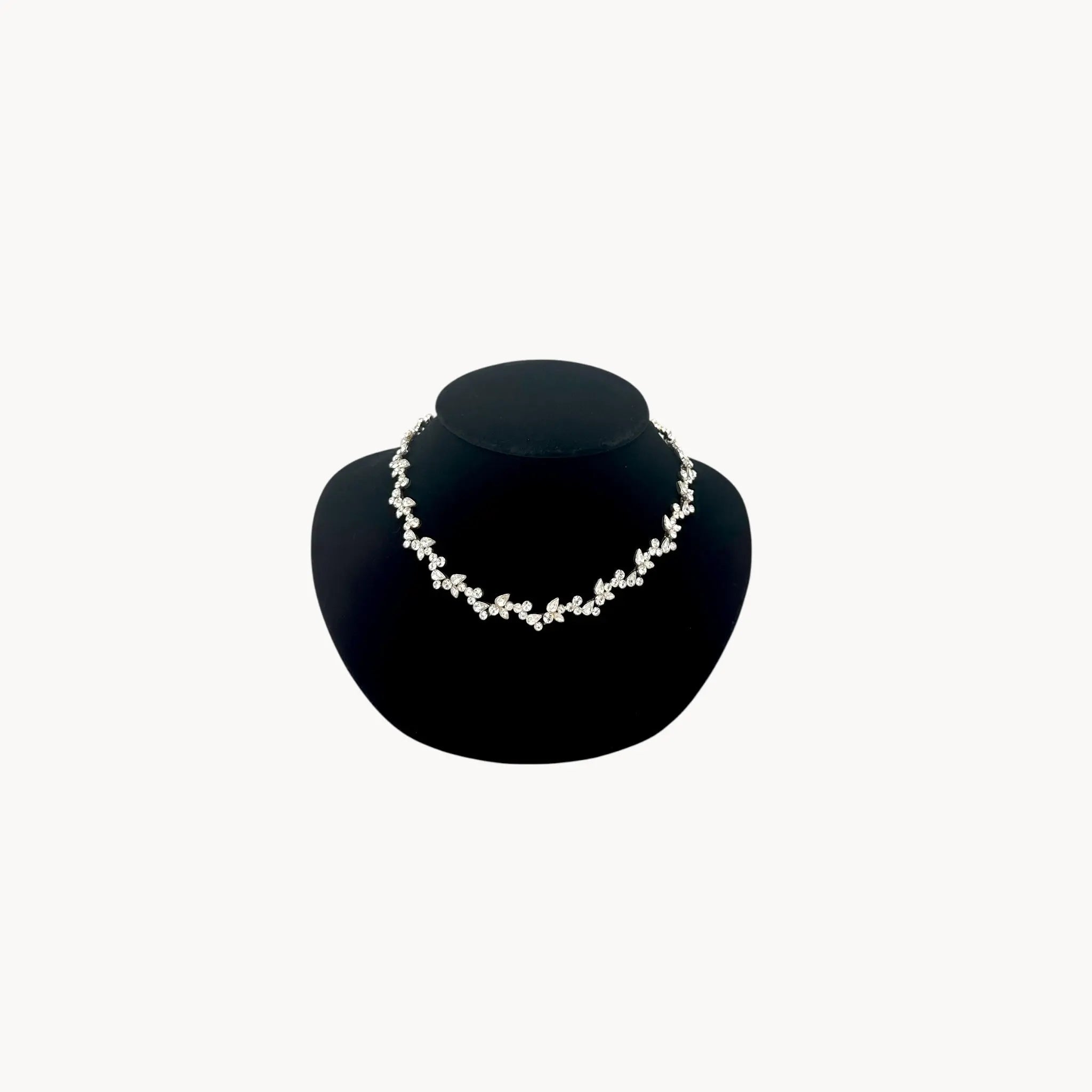 Givenchy silver-tone floral crystal rhinestone necklace, vintage bridal jewelry on black bust.