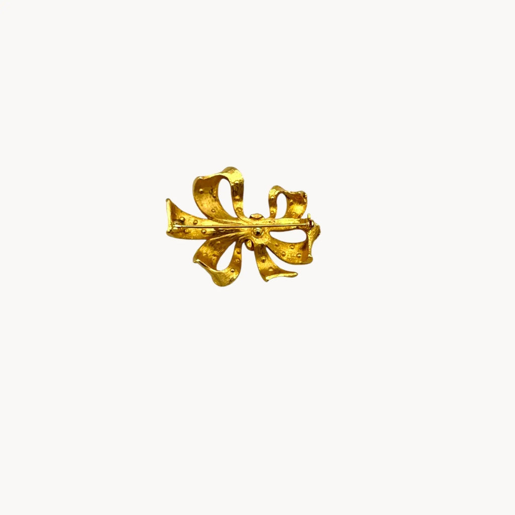 Back view of Vintage gold rhinestone bow brooch with ribbon design
