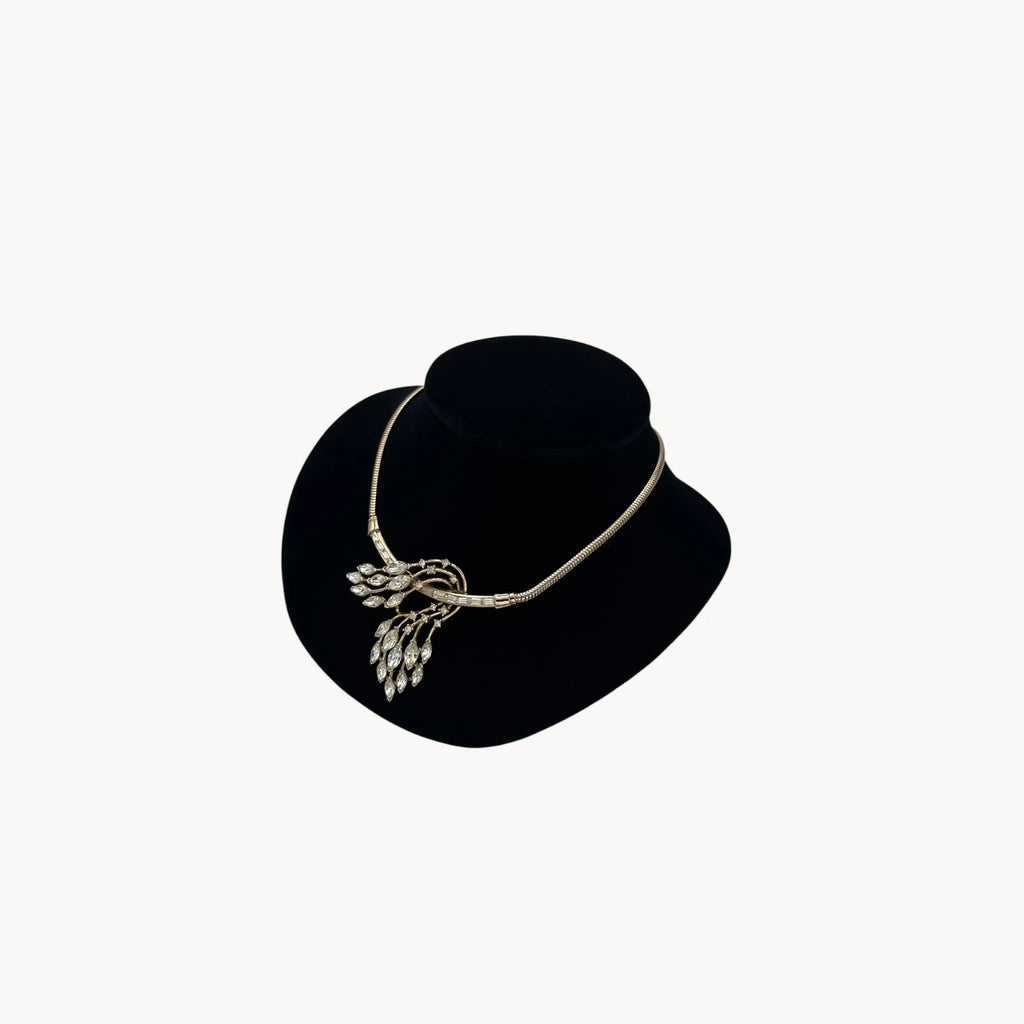 Right side view of 1950s Trifari rhinestone necklace with marquise spray design on snake chain, vintage mid-century bridal jewelry.