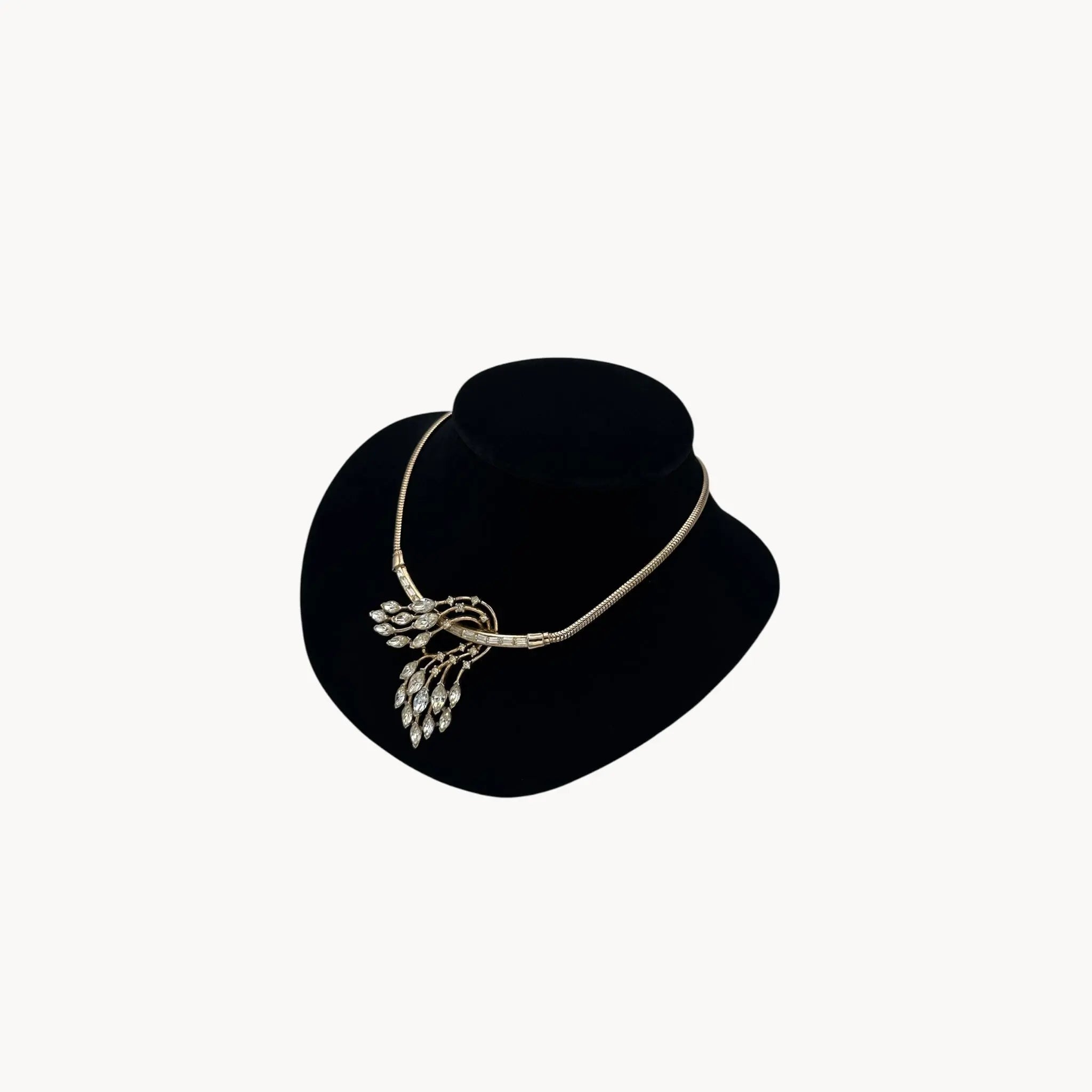 Right side view of 1950s Trifari rhinestone necklace with marquise spray design on snake chain, vintage mid-century bridal jewelry.