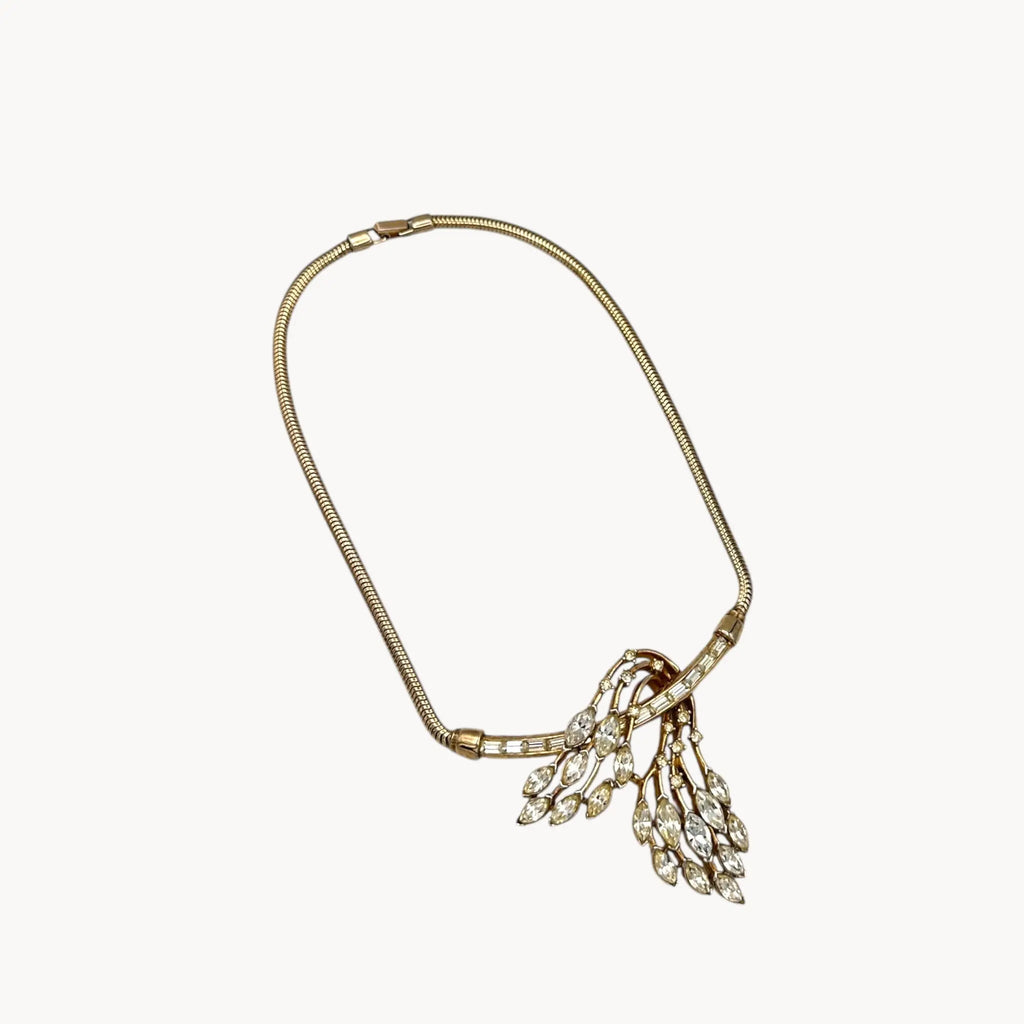 1950s Trifari rhinestone necklace with marquise spray design on snake chain, vintage mid-century bridal jewelry on white background.