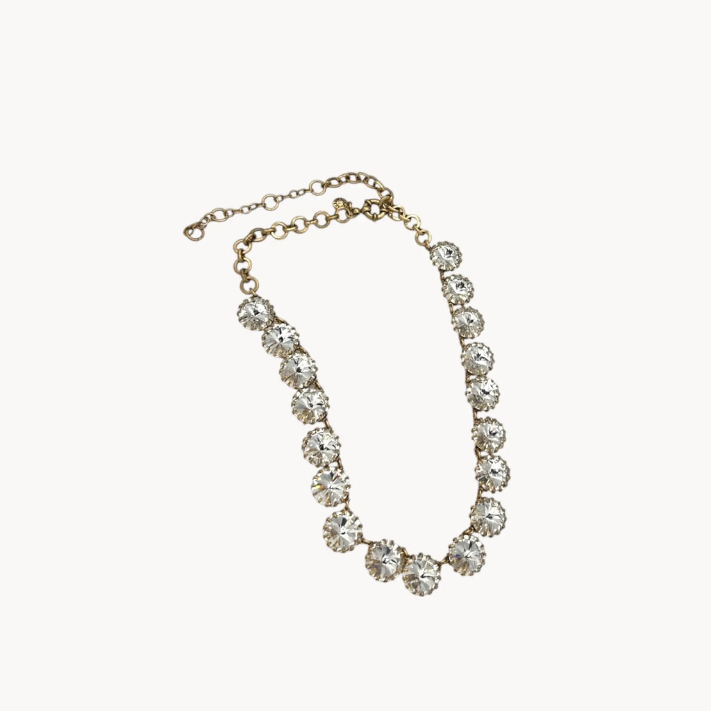 J. Crew Venus Flytrap necklace with large clear round rhinestones on white background.