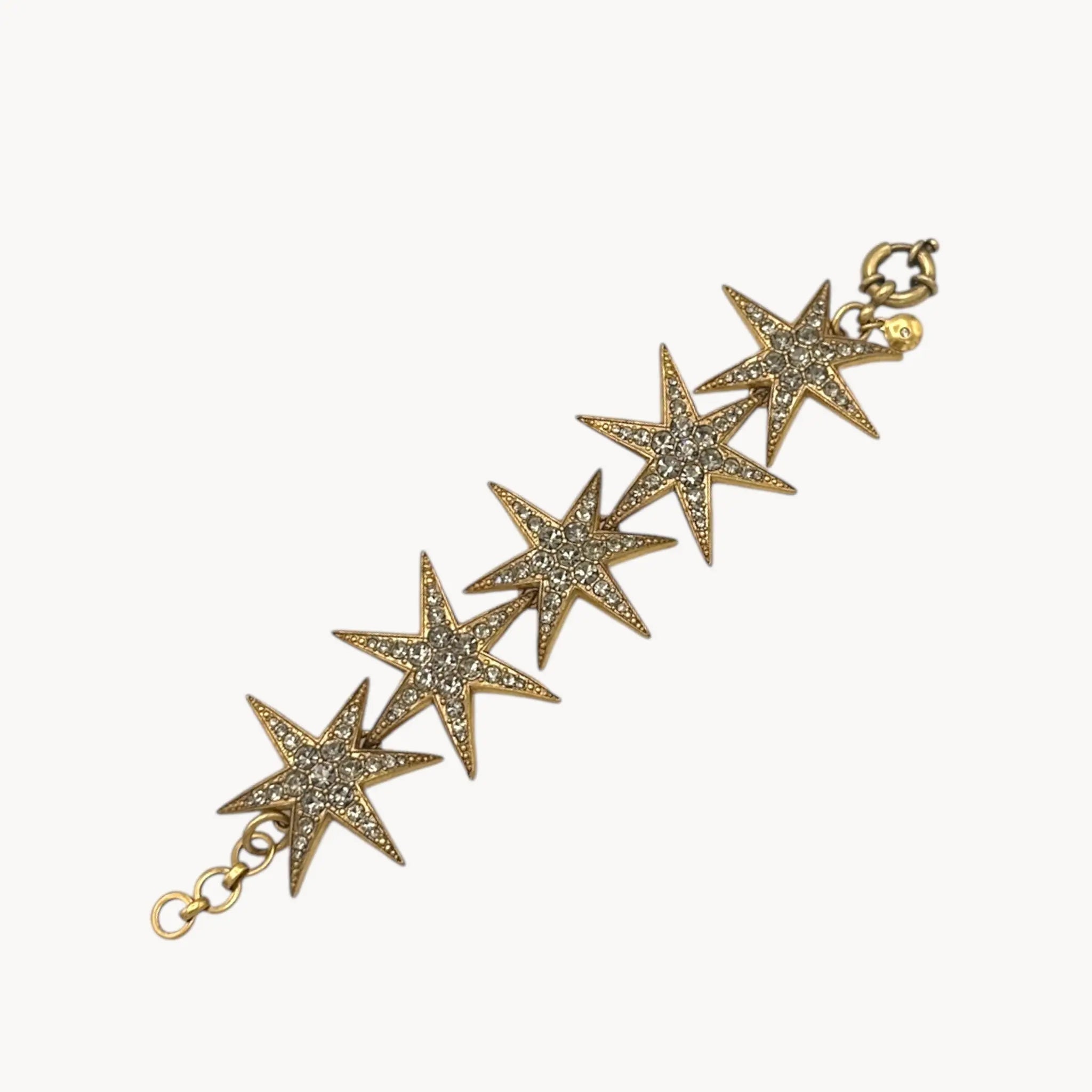 J. Crew gold-tone Art Deco style star bracelet with crystal accents on white background.