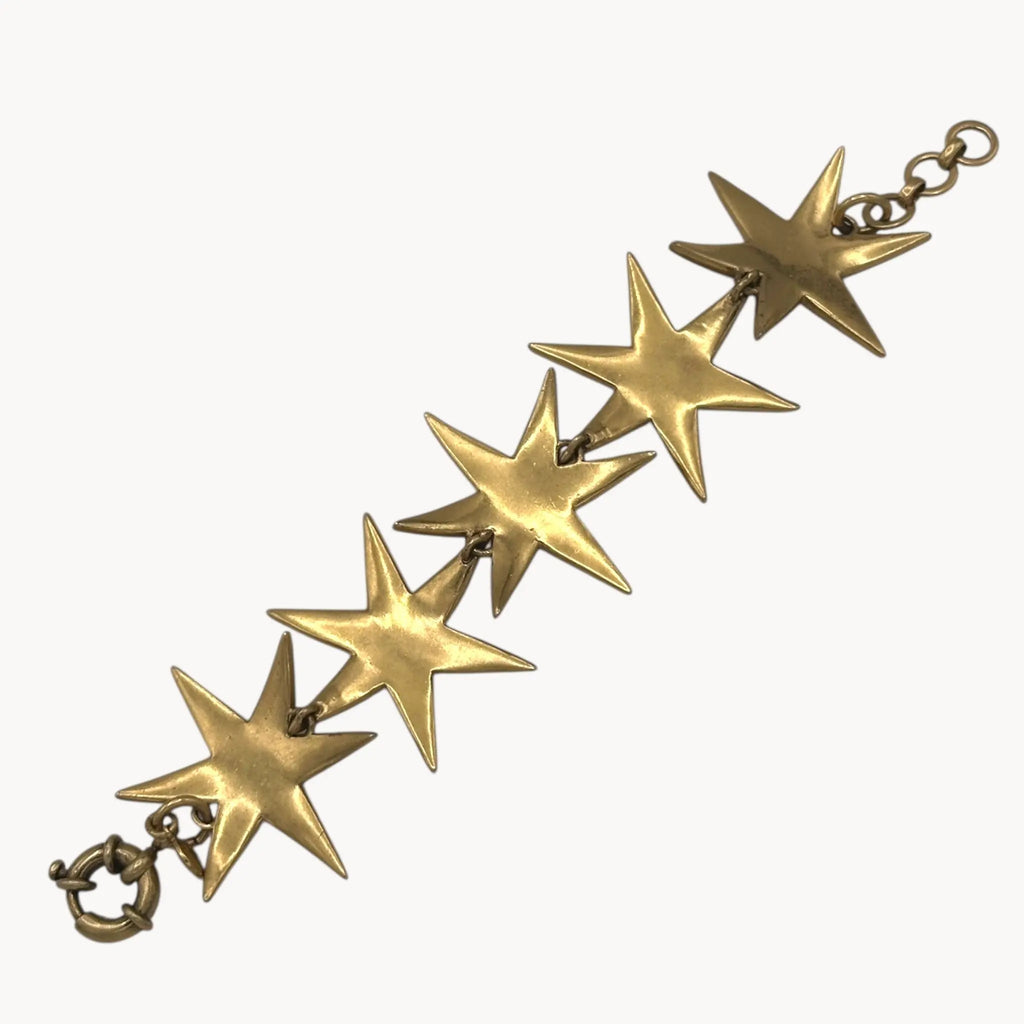 Back view of J. Crew gold-tone Art Deco style star bracelet with crystal accents on white background.