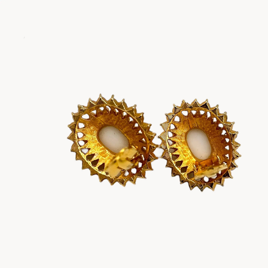 Clips open of Gold Joseph Mazer Jomaz White Cabochon & Rhinestone Earrings shown on white background.