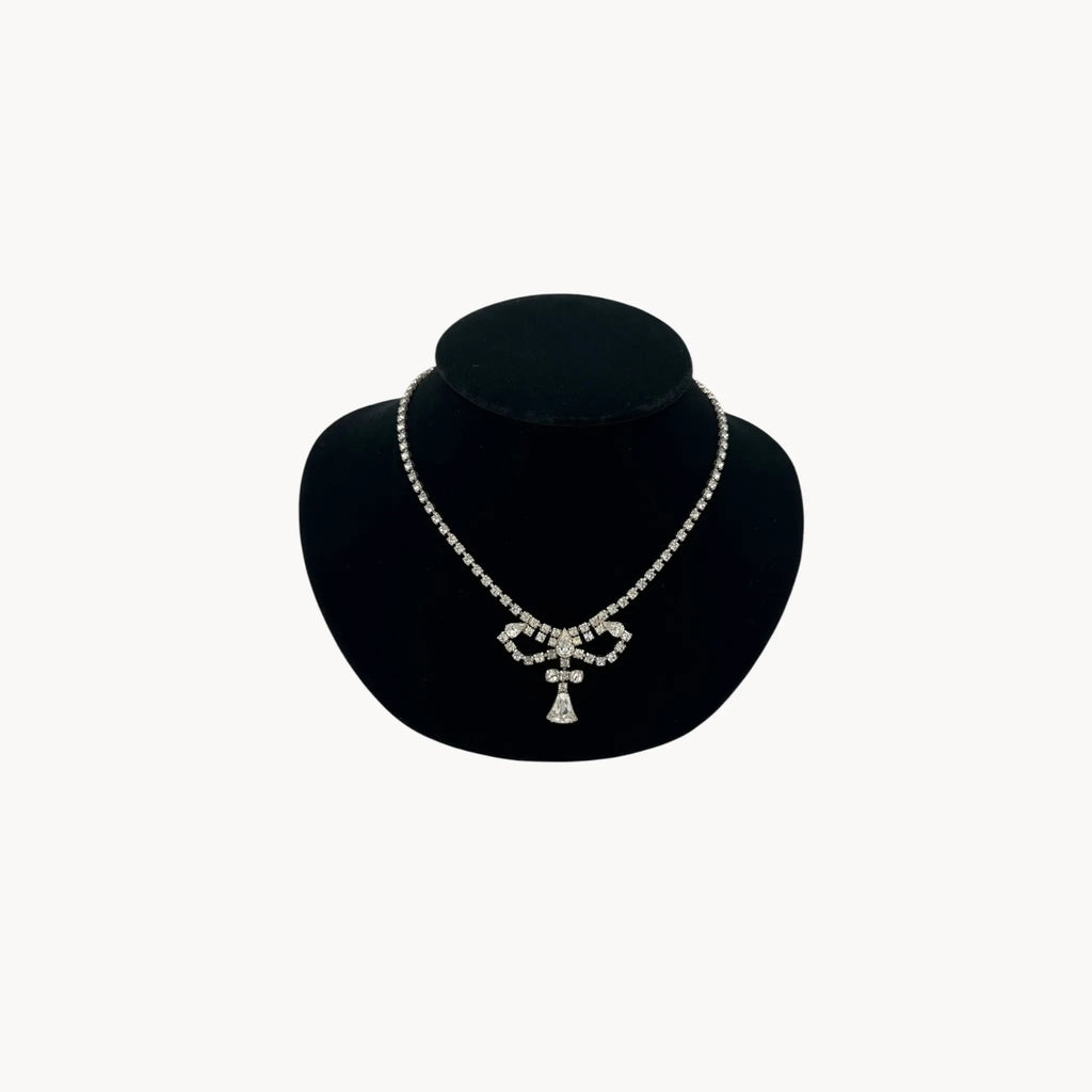 1950s Leo Glass rhinestone necklace with bow centerpiece and teardrop pendant, vintage mid-century bridal jewelry.