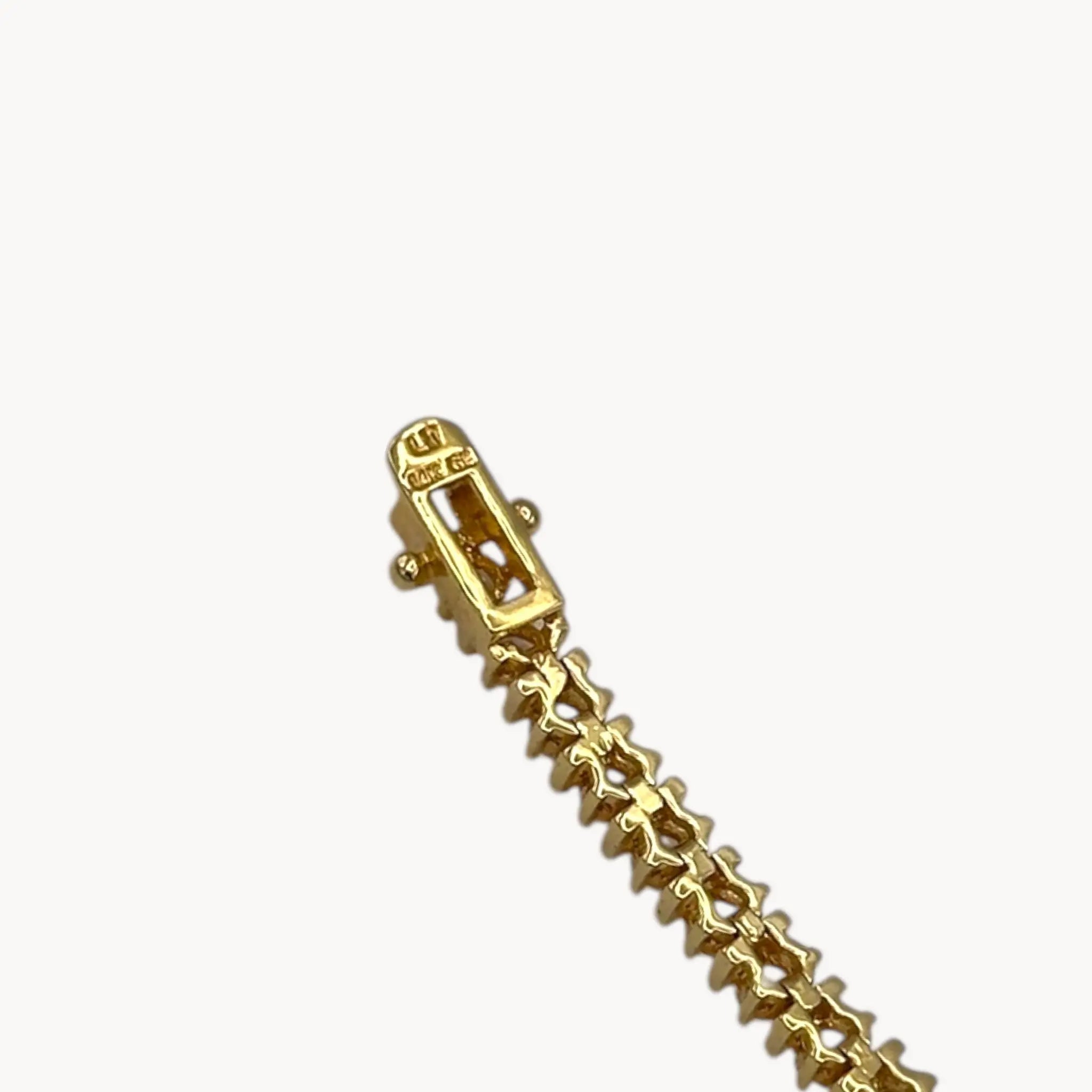 Clasp view of Lind 14K gold electroplated clear CZ tennis bracelet.