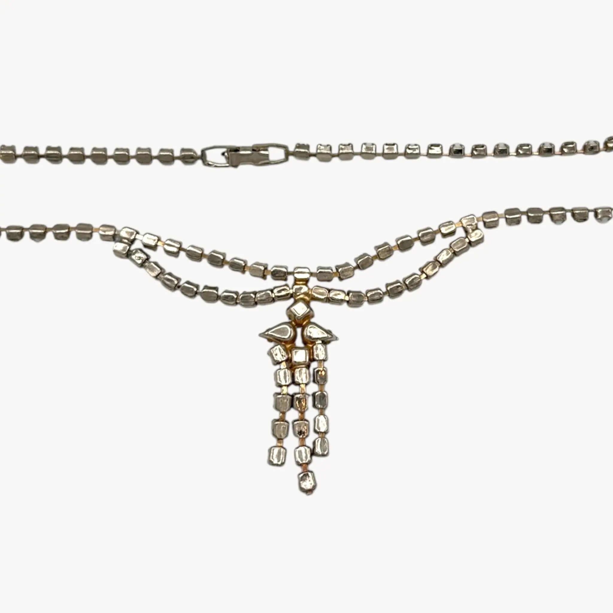 Back view of Vintage mid-century rhinestone and milk glass draped necklace with pendant drop.