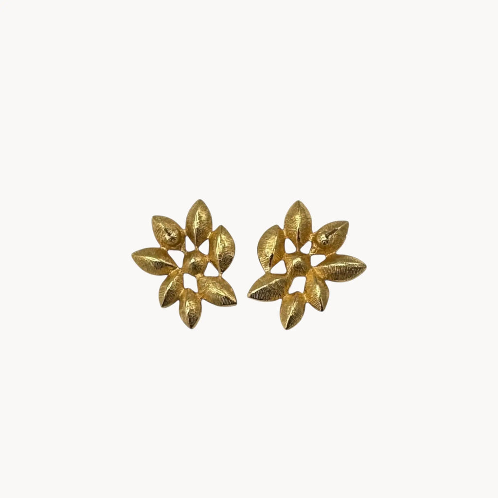 Back view of Monet vintage gold tone pierced earrings with clear marquise rhinestones arranged in a floral pattern, elegant 1980s bridal jewelry shown on white background.