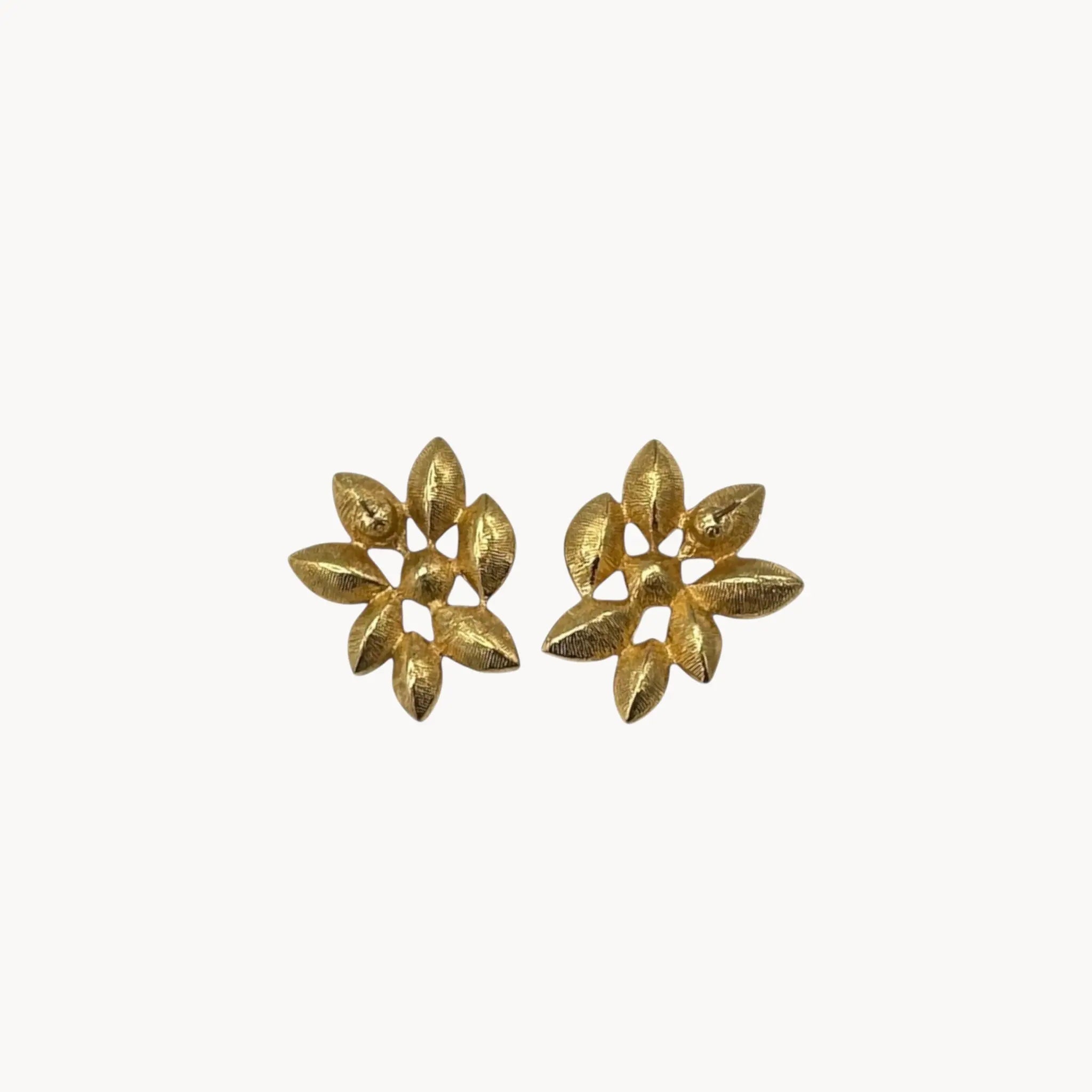 Back view of Monet vintage gold tone pierced earrings with clear marquise rhinestones arranged in a floral pattern, elegant 1980s bridal jewelry shown on white background.
