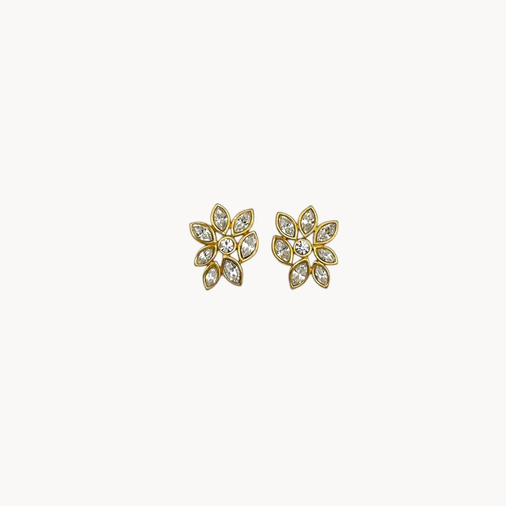Monet vintage gold tone pierced earrings with clear marquise rhinestones arranged in a floral pattern, elegant 1980s bridal jewelry shown on white background.