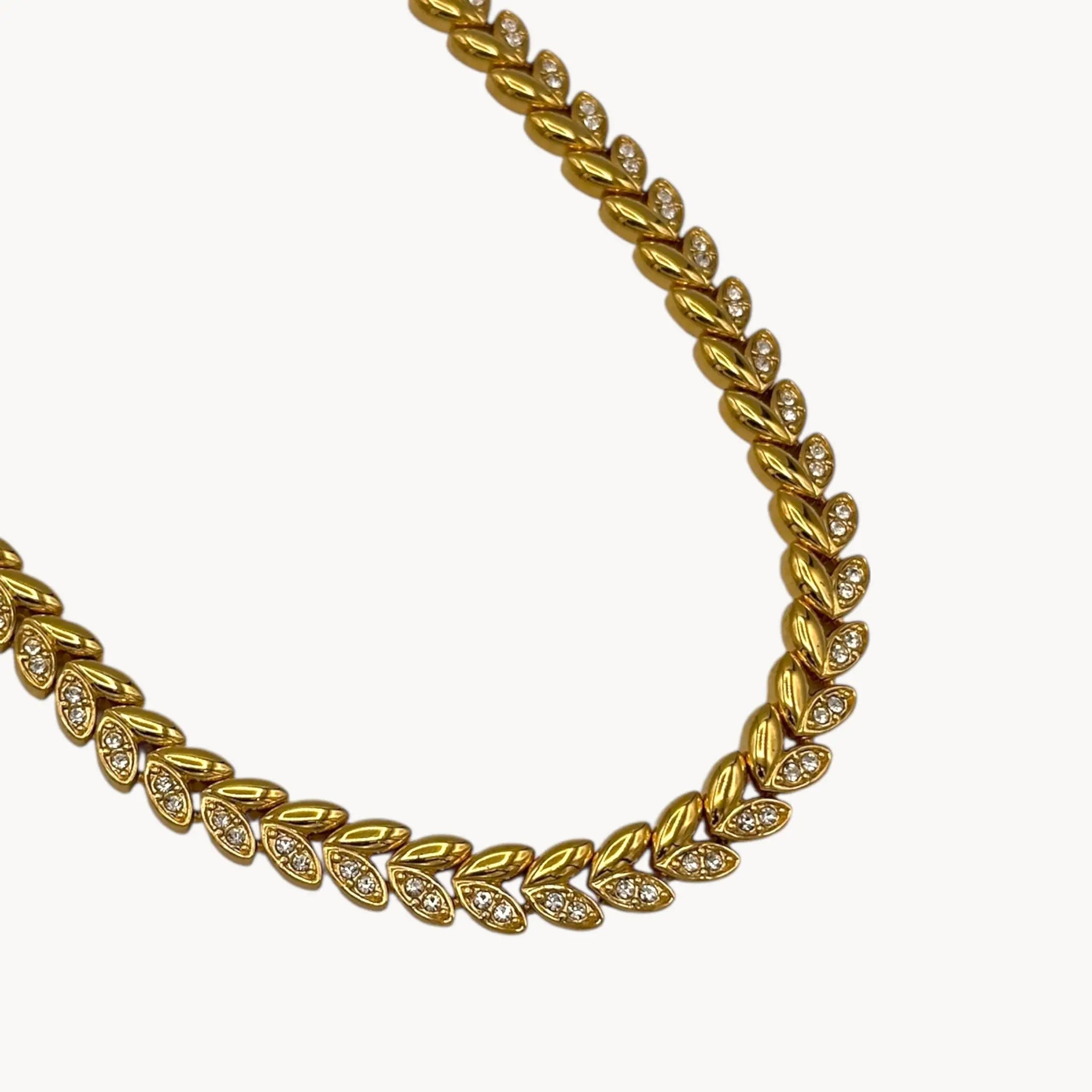 Close up view of links on Avon vintage gold link rhinestone necklace, classic 1980s–1990s bridal and evening jewelry.