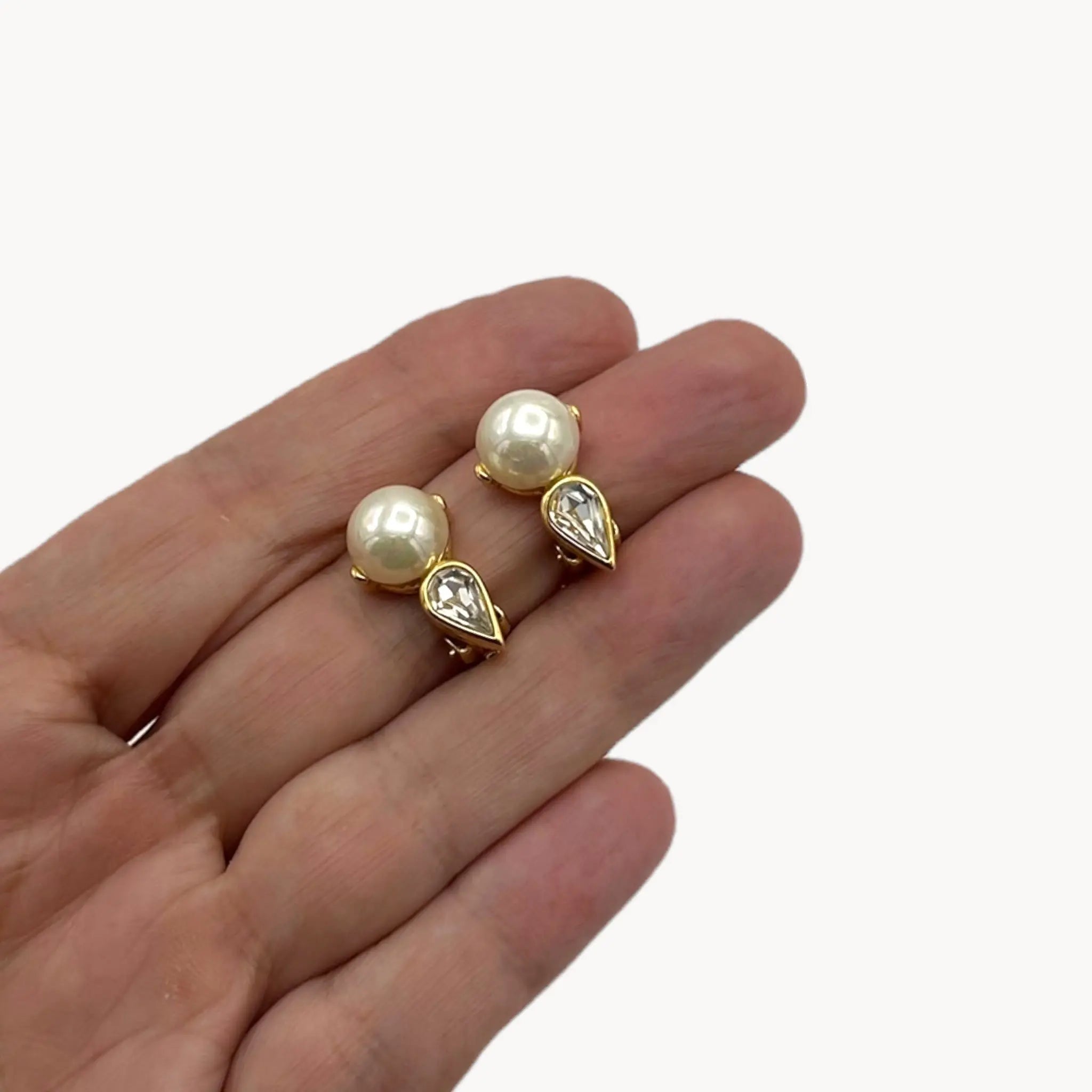 Scale size view Nina Ricci vintage faux pearl and crystal teardrop clip-on earrings, 1980s bridal jewelry.