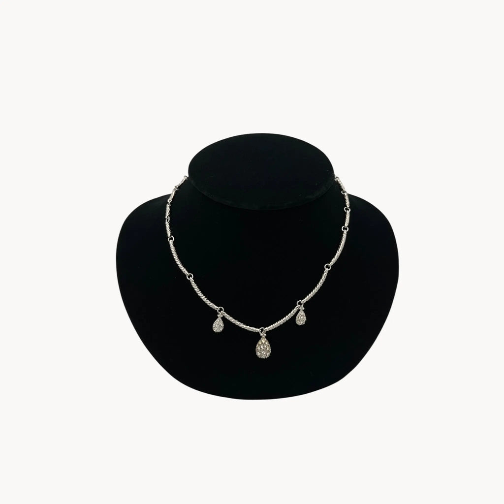 Close up view of Nolan Miller silver adjustable necklace with removable rhinestone teardrop dangles, vintage bridal jewelry.