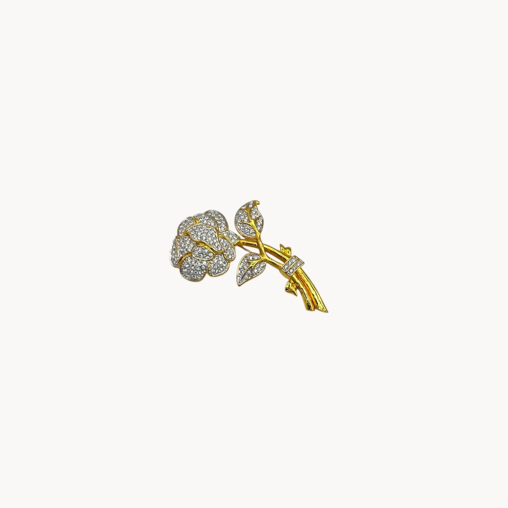 Nolan Miller gold and rhinestone flower brooch with pavé crystal accents