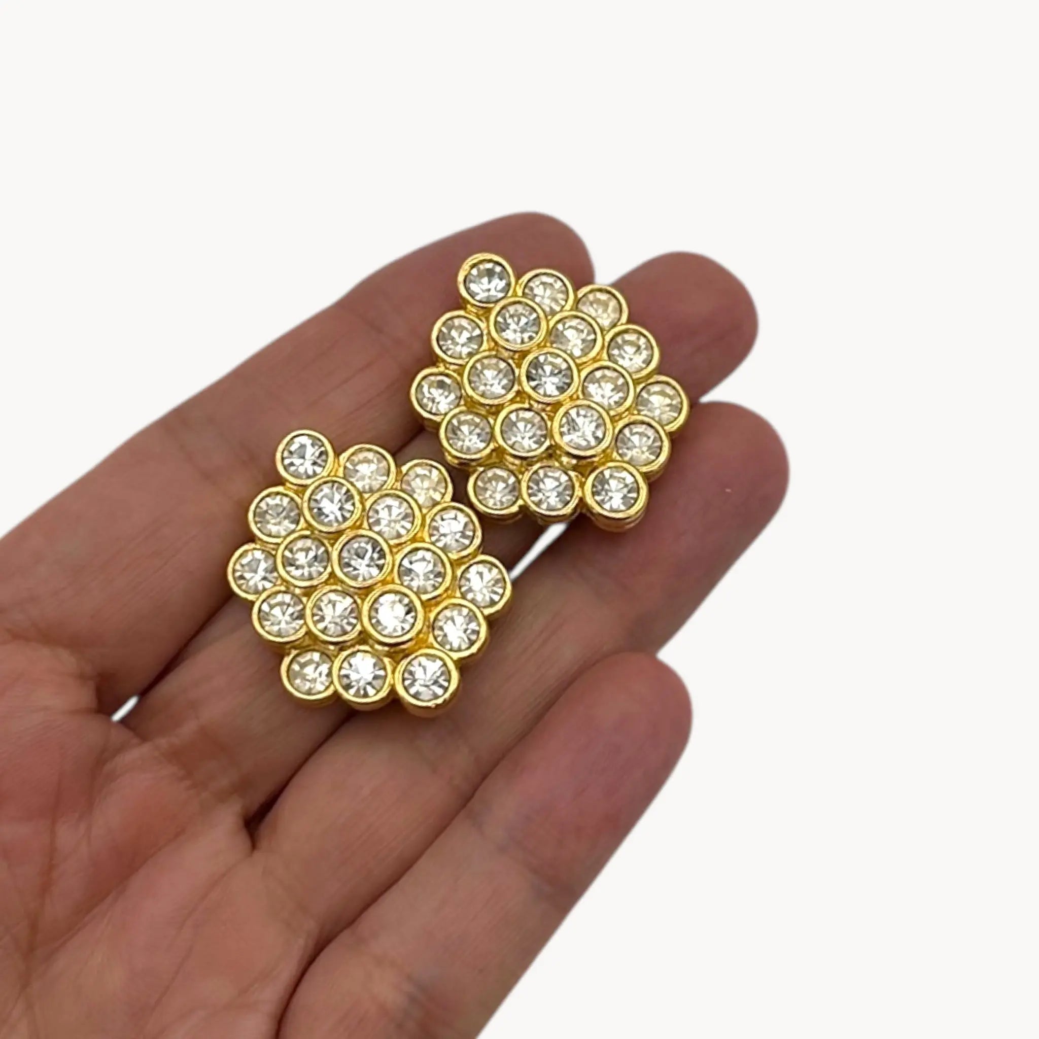 Size view of Nolan Miller gold rhinestone cluster clip on earrings